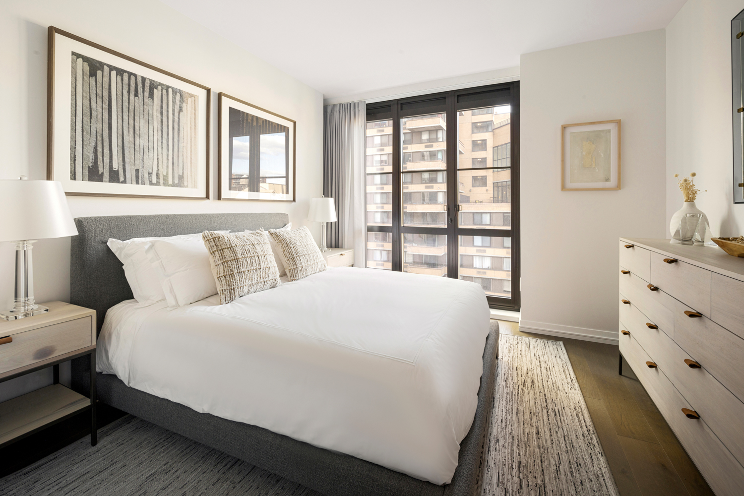 250 West 96th Street, Unit 10C Manhattan, NY 10025 - Photo 5 of 25 a large white bed in a bedroom next to a window