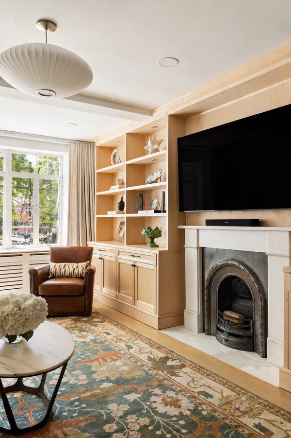 a living room with furniture and a fireplace