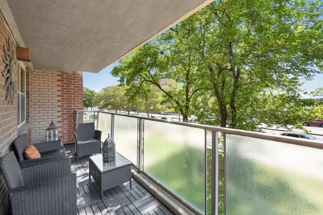 a balcony with chairs