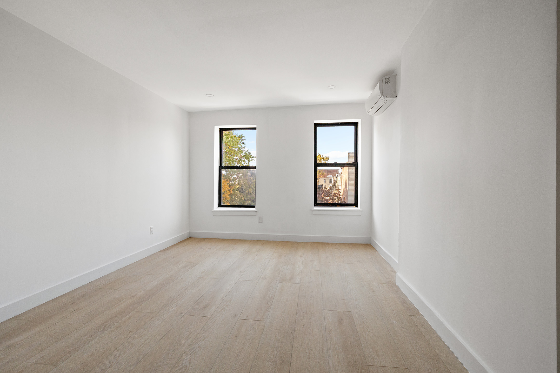 1671 8th Avenue, Unit 3L Brooklyn, NY 11215 - Photo 2 of 7 an empty room with windows