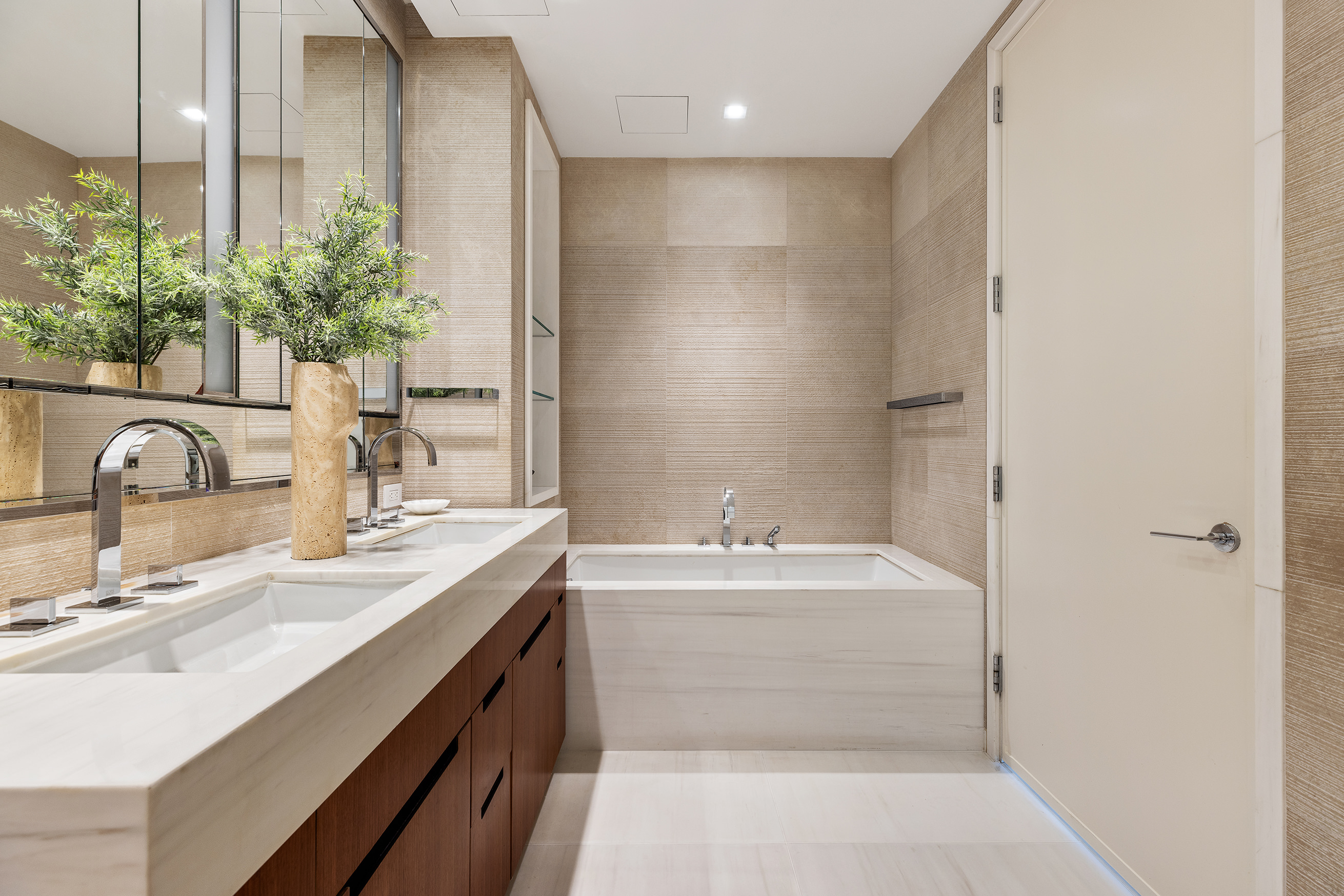 1 West End Avenue, Unit 15E Manhattan, NY 10023 - Photo 6 of 31 a bathroom with a sink double vanity and a mirror