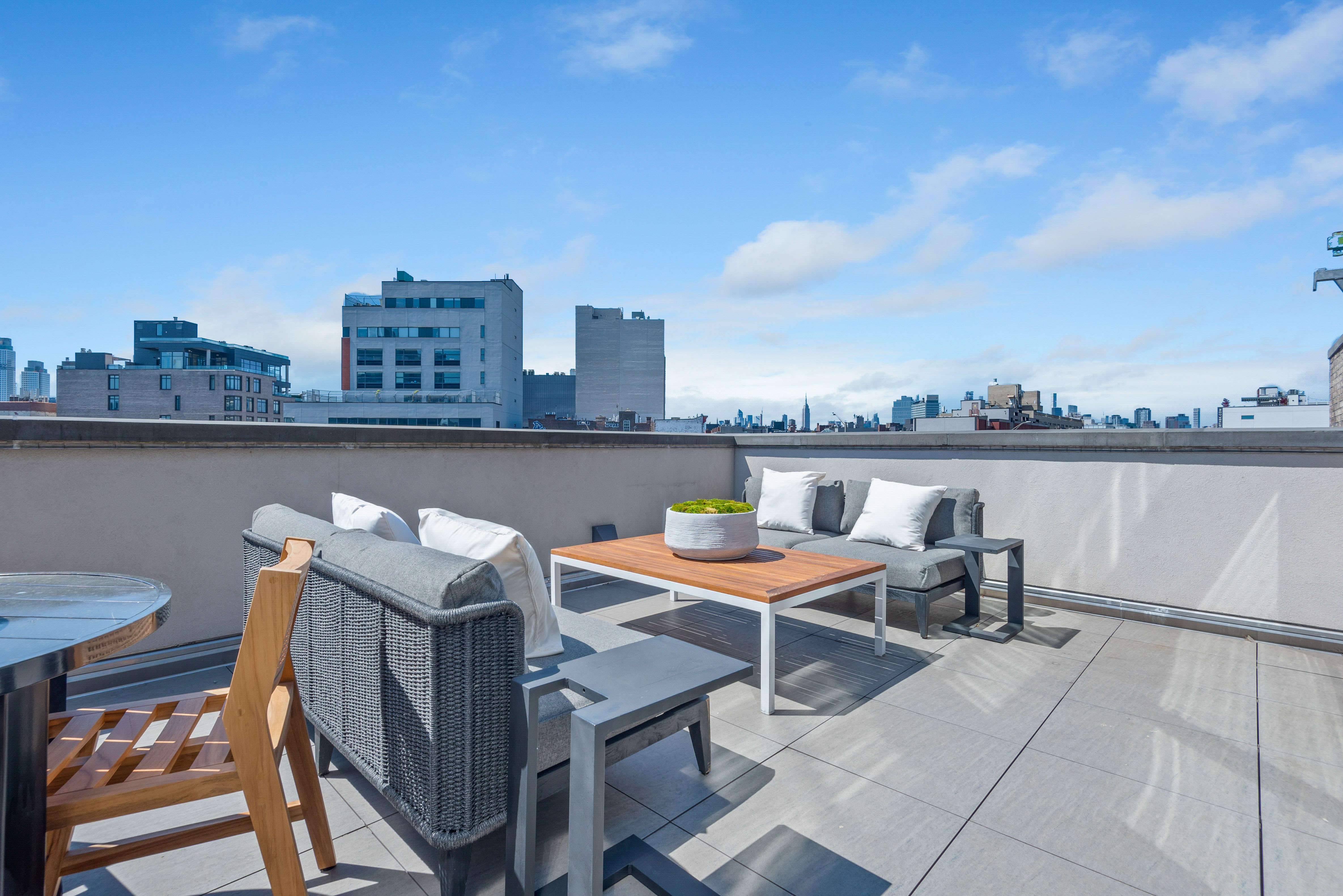 476 Union Avenue, Unit PH5A Brooklyn, NY 11211 - Photo 9 of 17 a view of a chairs and table on the terrace