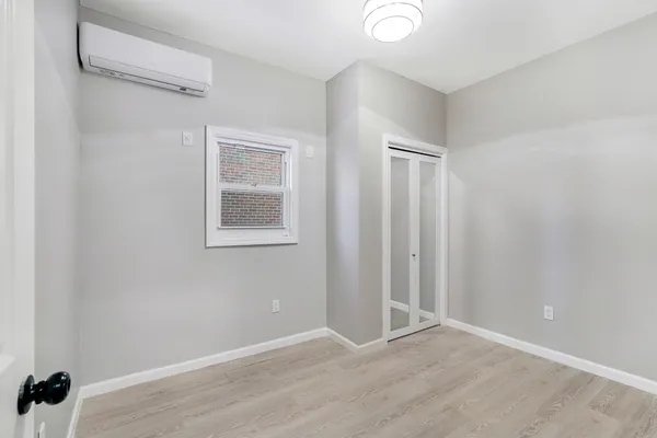 a view of an empty room with a window