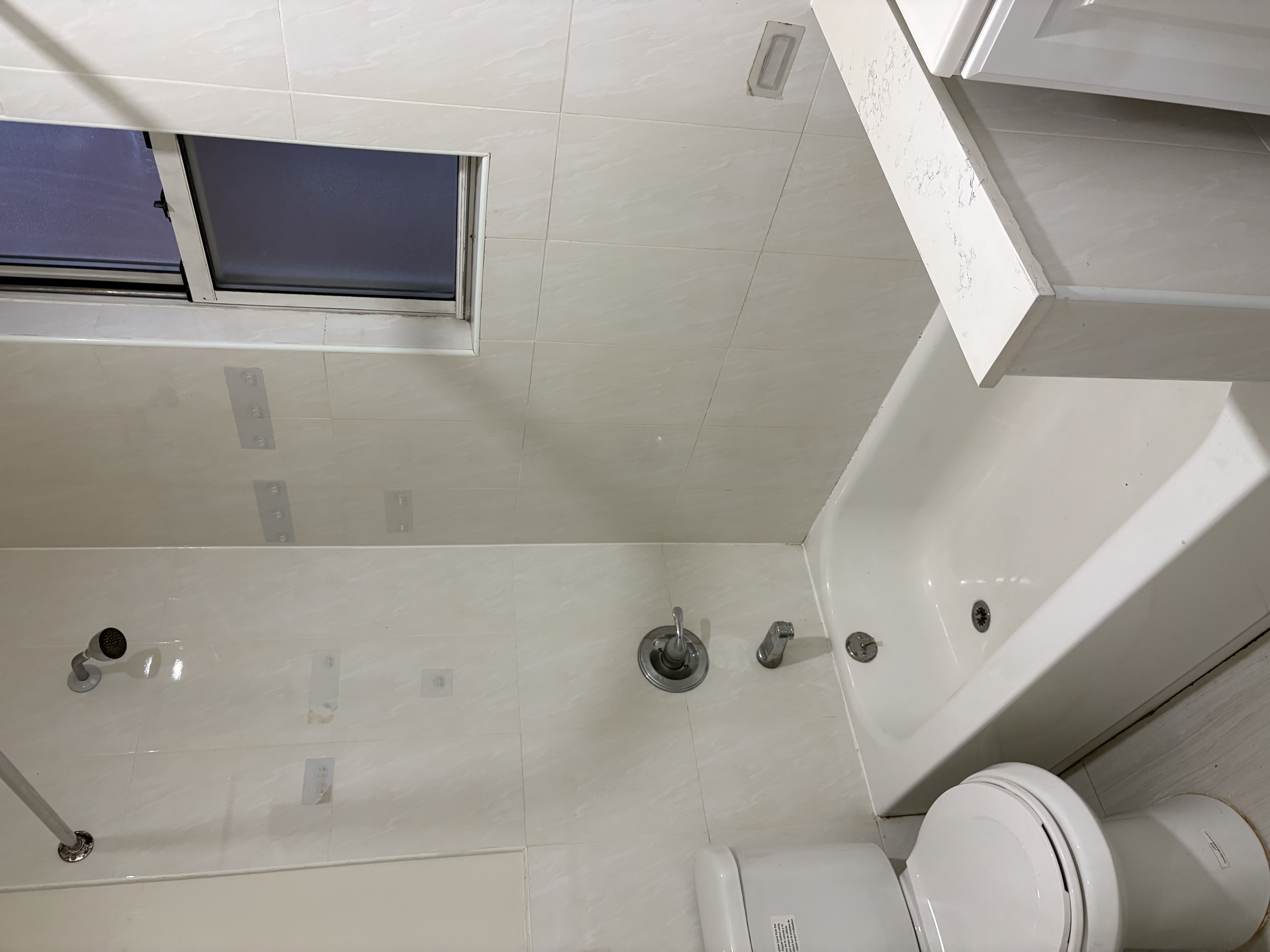 8703 5th Avenue, Unit 2F Brooklyn, NY 11209 - Photo 8 of 9 a bathroom with a bathtub and sink