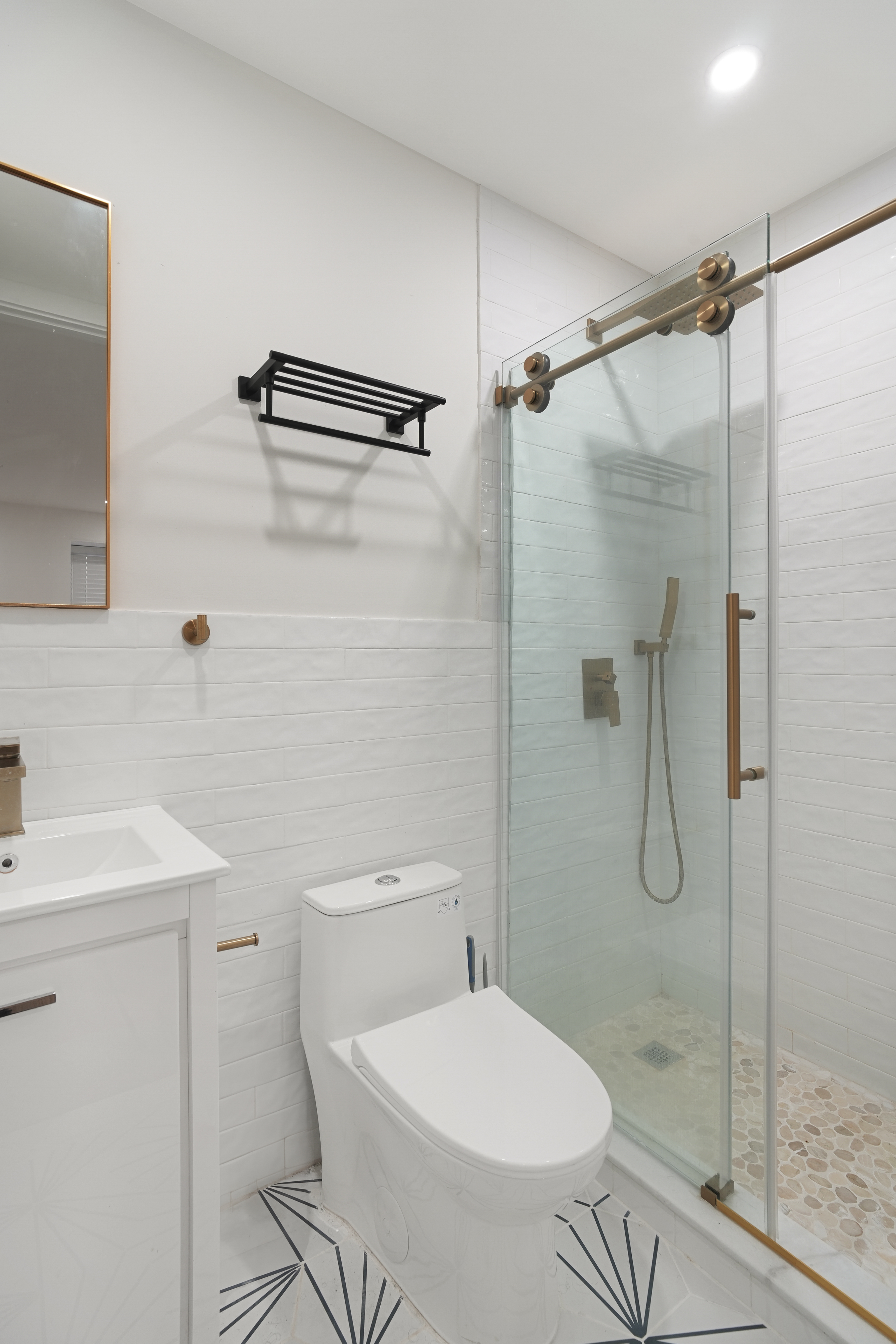 1390 Eastern Parkway Brooklyn, NY 11233 - Photo 10 of 19 a bathroom with a toilet and a shower