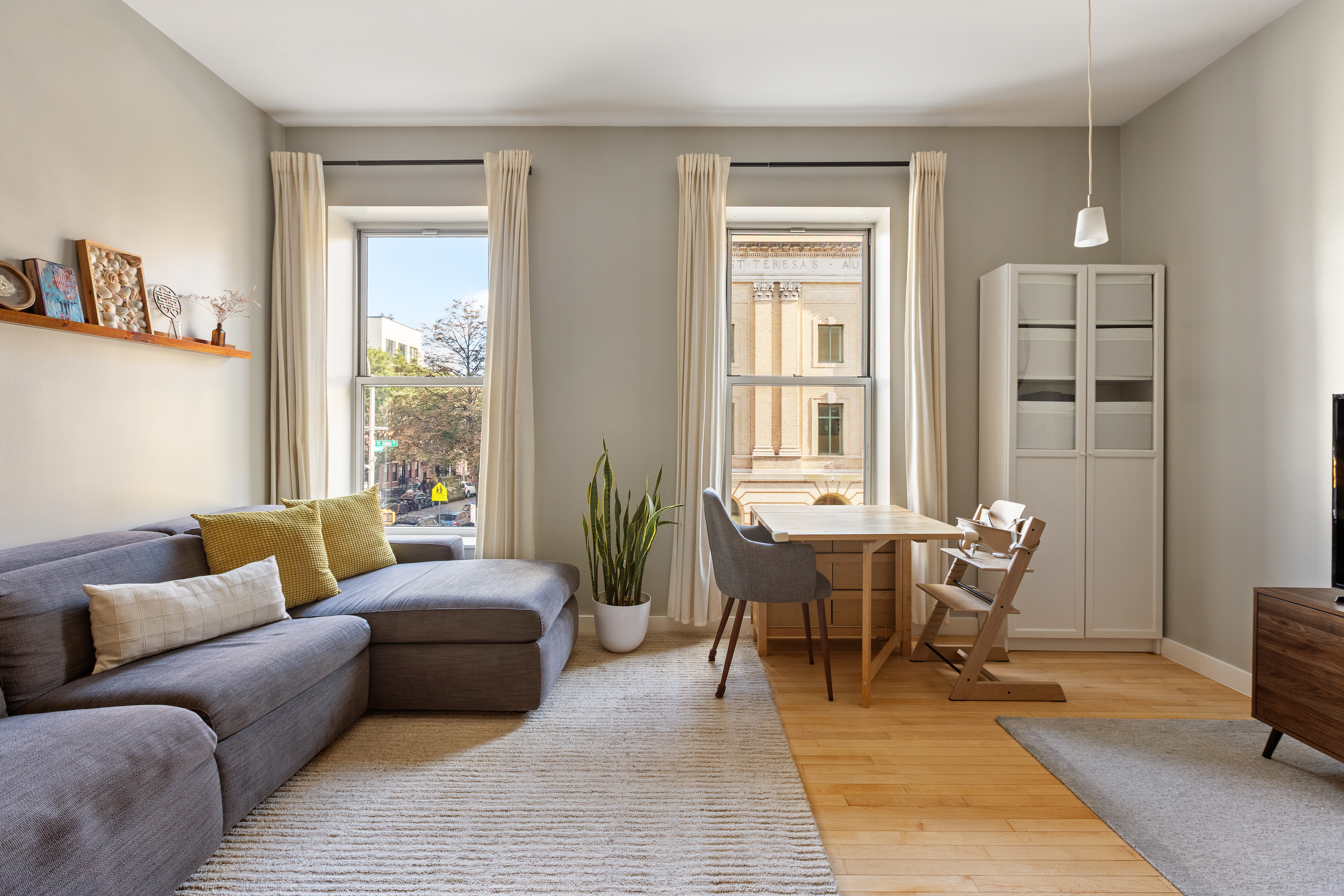 524 St Johns Place, Unit 2A Brooklyn, NY 11238 - Photo 2 of 8 a living room with furniture rug and window