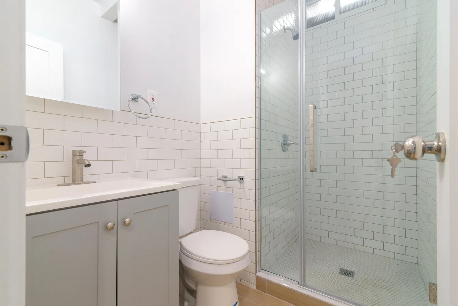 a bathroom with a sink toilet and shower