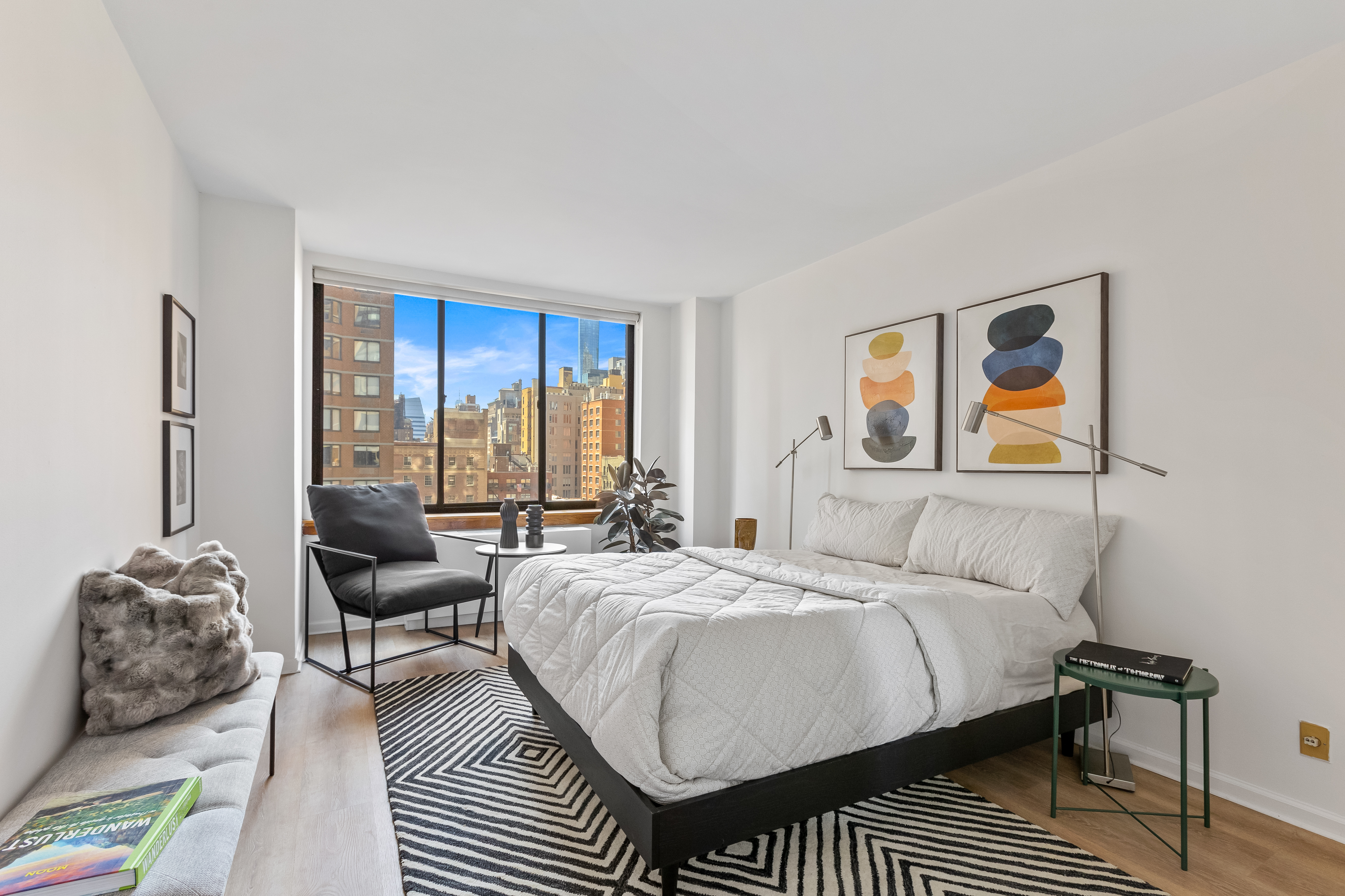 157 East 32nd Street, Unit 8A Manhattan, NY 10016 - Photo 6 of 16 a bedroom with a bed and wooden floor