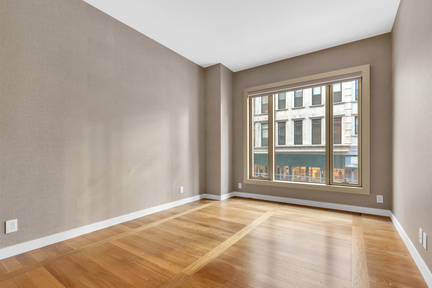 30 Warren Street, Unit 2C Manhattan, NY 10007 - Photo 9 of 18 a view of an empty room with a window