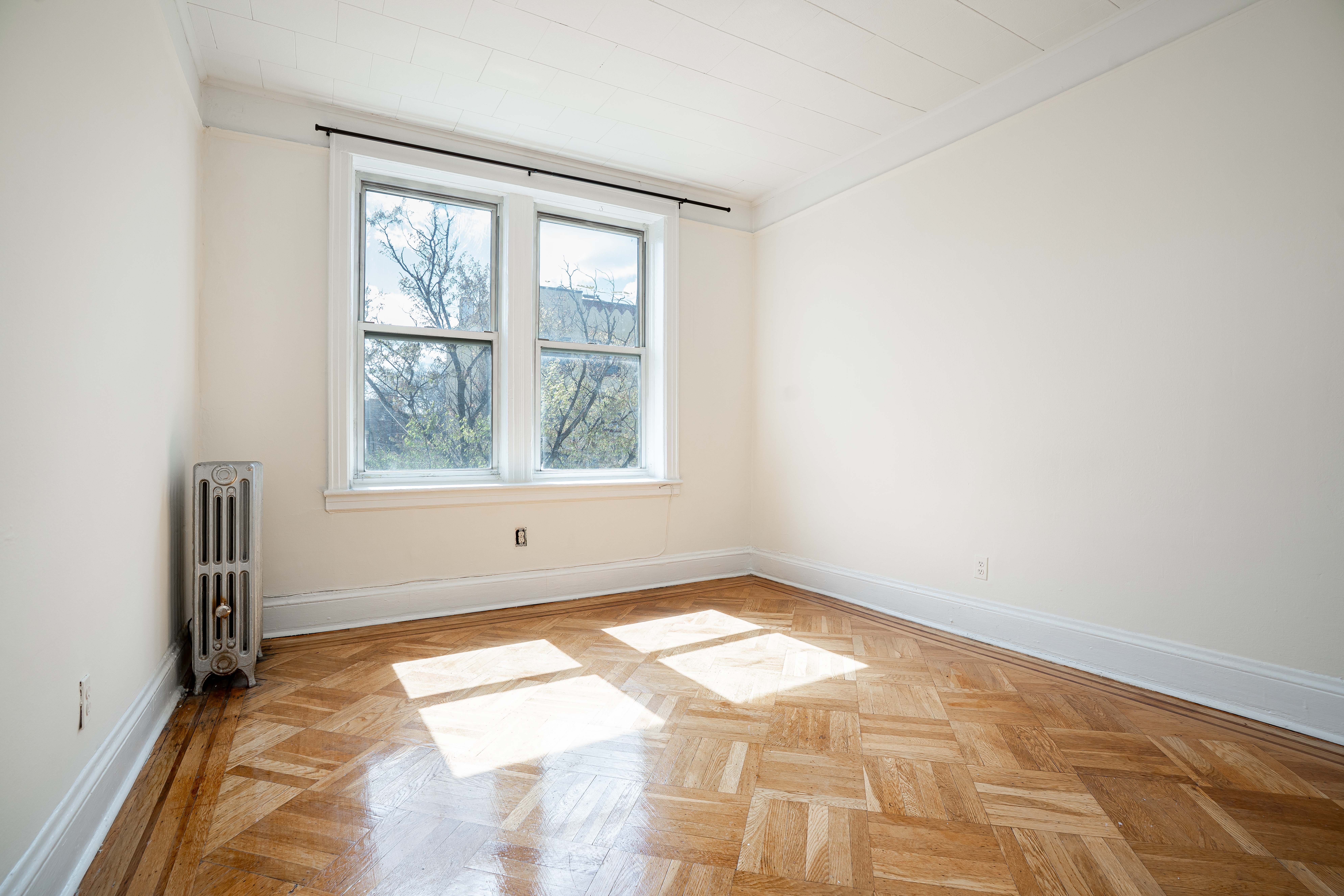 27-15 24th Avenue, Unit 2 Queens, NY 11105 - Photo 8 of 10 a view of a room with a window