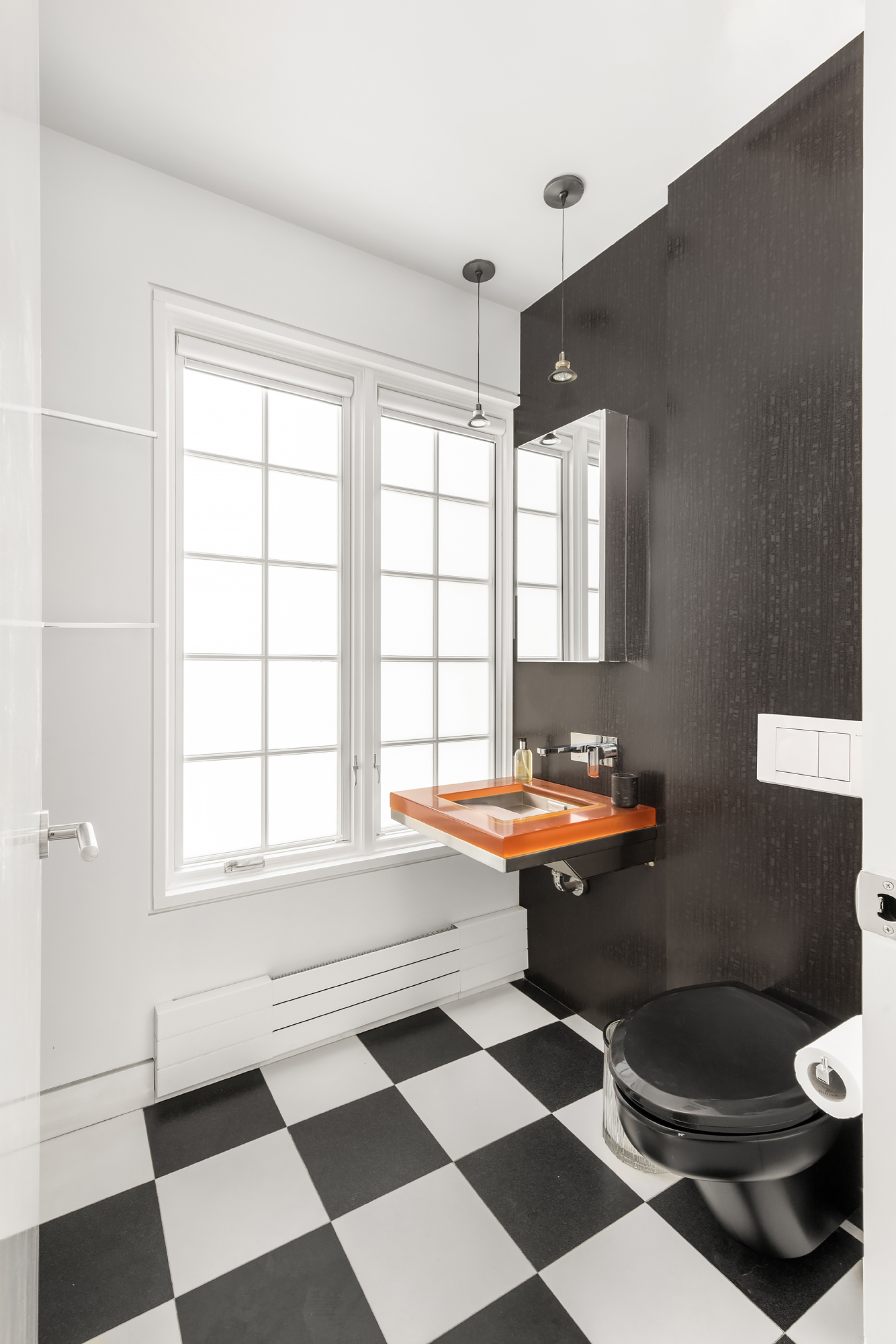 21 Cornelia Street Manhattan, NY 10014 - Photo 24 of 26 a room with a black white checkered floor with a gaming machine and wooden floor