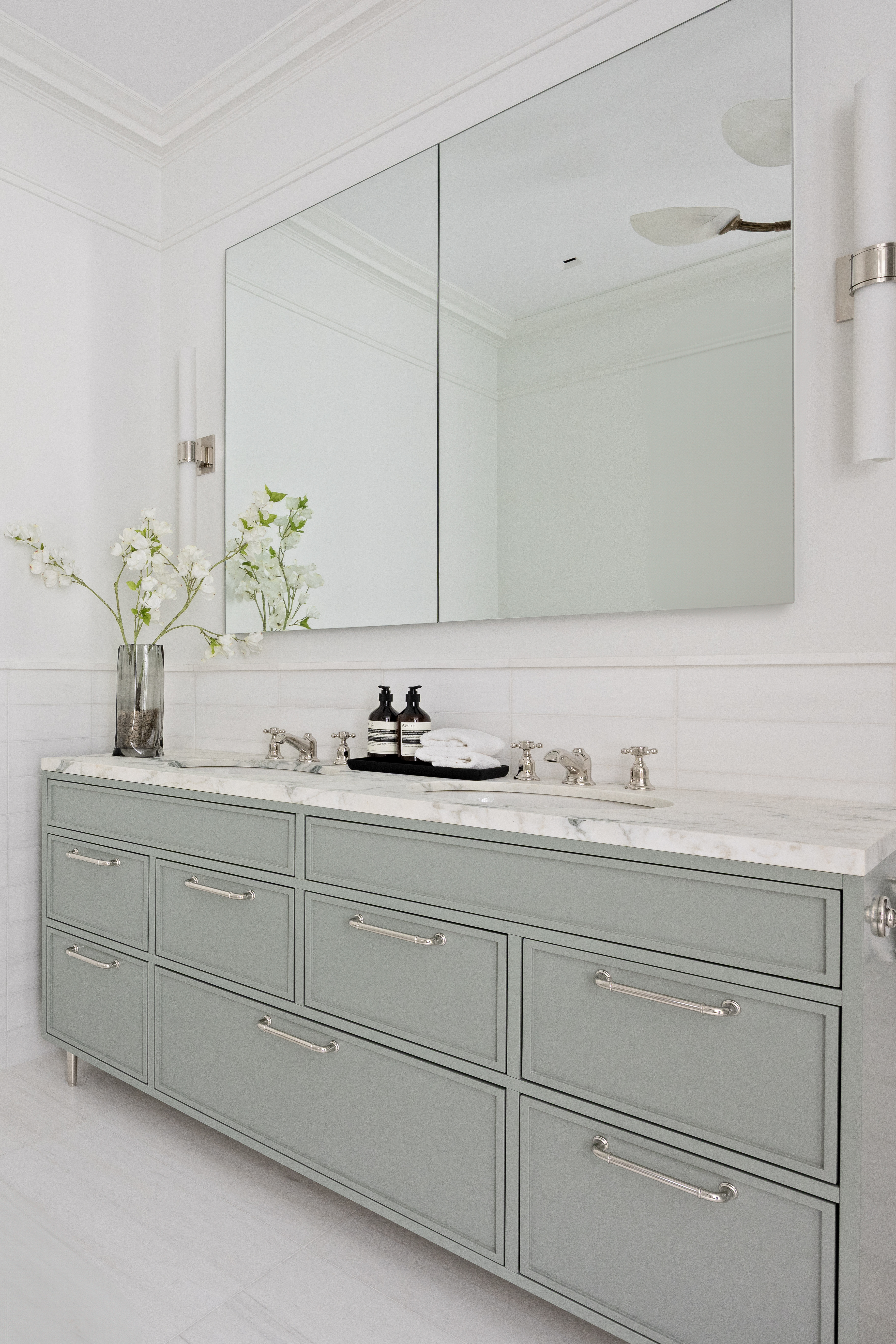 1020 5th Avenue, Unit 9 Manhattan, NY 10028 - Photo 18 of 27 a bathroom with a sink and mirror
