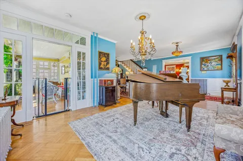 a view of a livingroom with furniture window and wooden floor