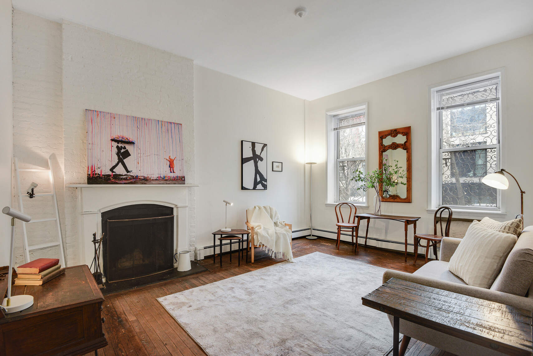 217 West 15th Street Manhattan, NY 10011 - Photo 14 of 21 a living room with furniture and a fireplace
