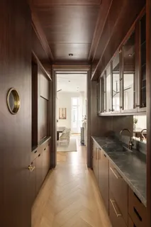 a kitchen with granite countertop a sink stove and cabinets