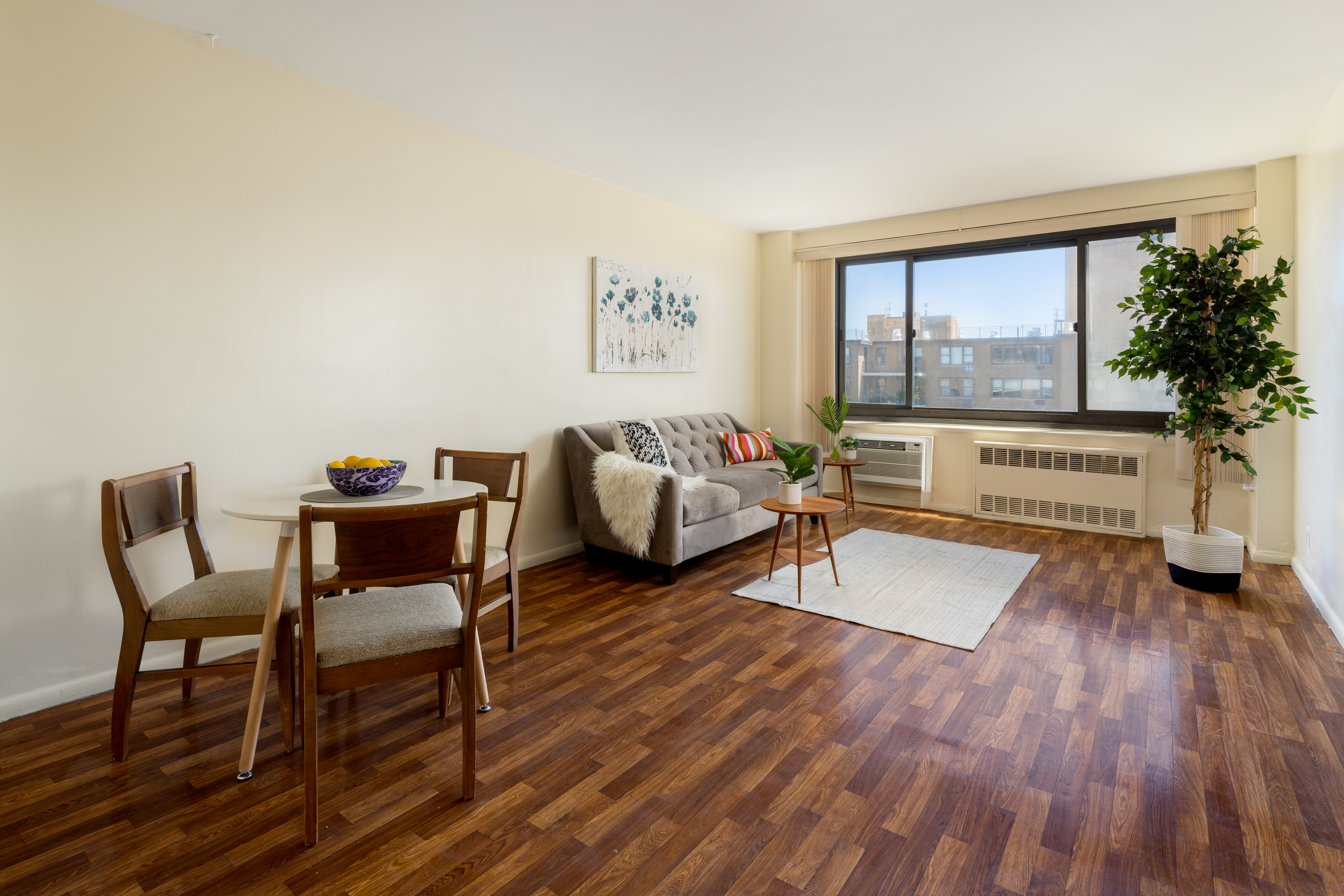 195 Willoughby Avenue, Unit 1610 Brooklyn, NY 11205 - Photo 2 of 7 a living room with furniture and a large window