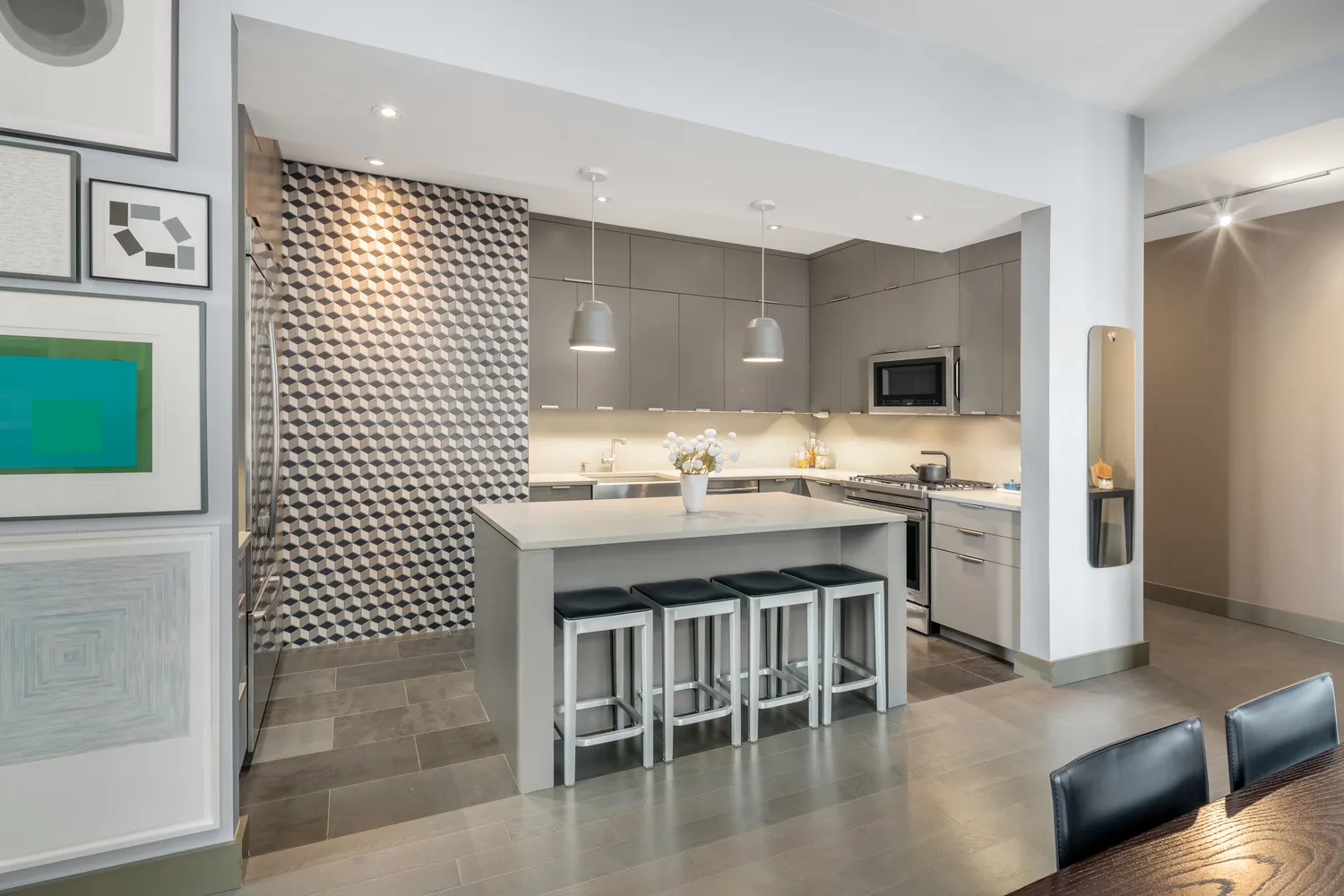 a kitchen with a sink dishwasher a stove and a refrigerator with wooden floor