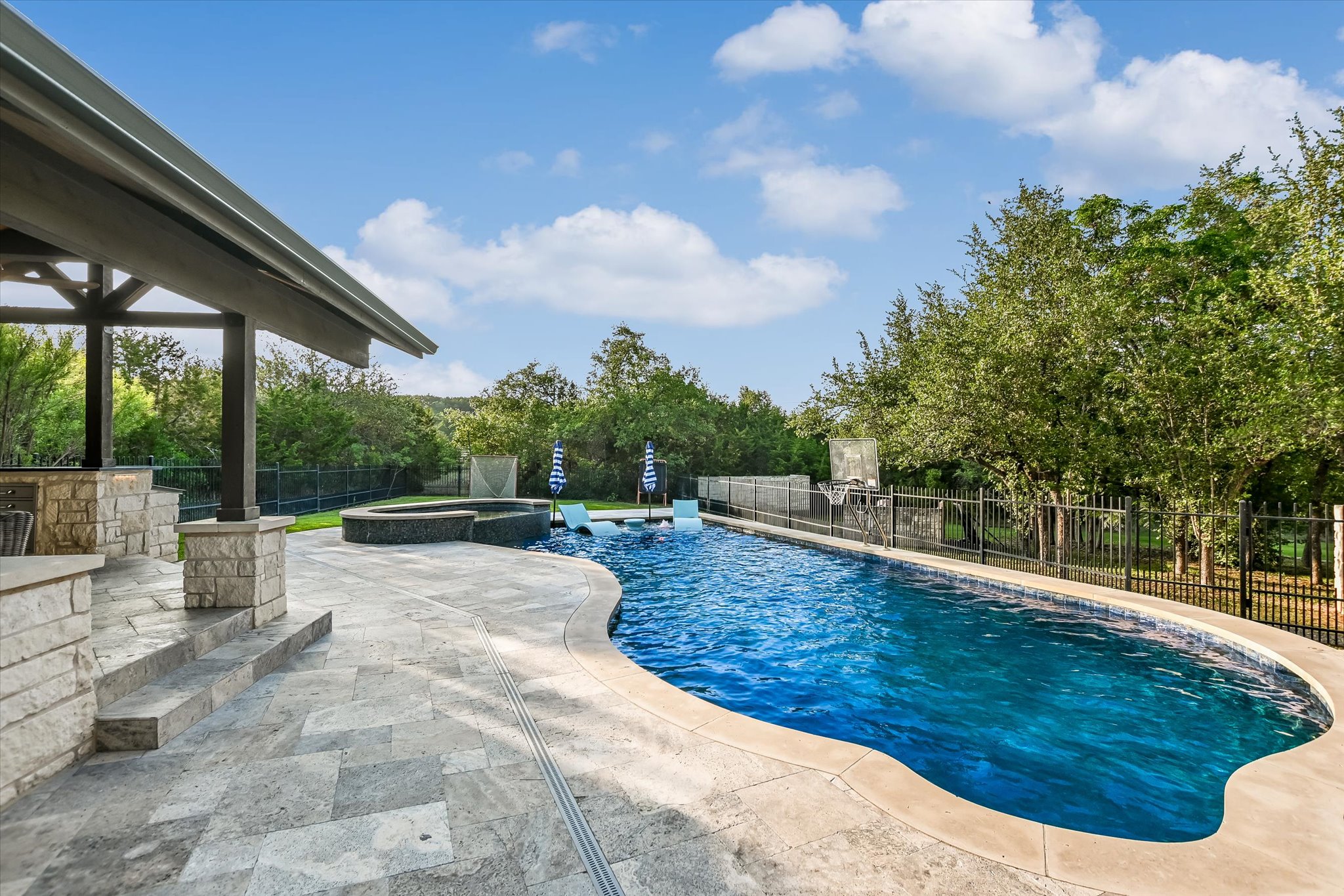 1422 Palomino Ridge Drive Austin, TX 78733 - Photo 49 of 60 a view of a swimming pool with a patio