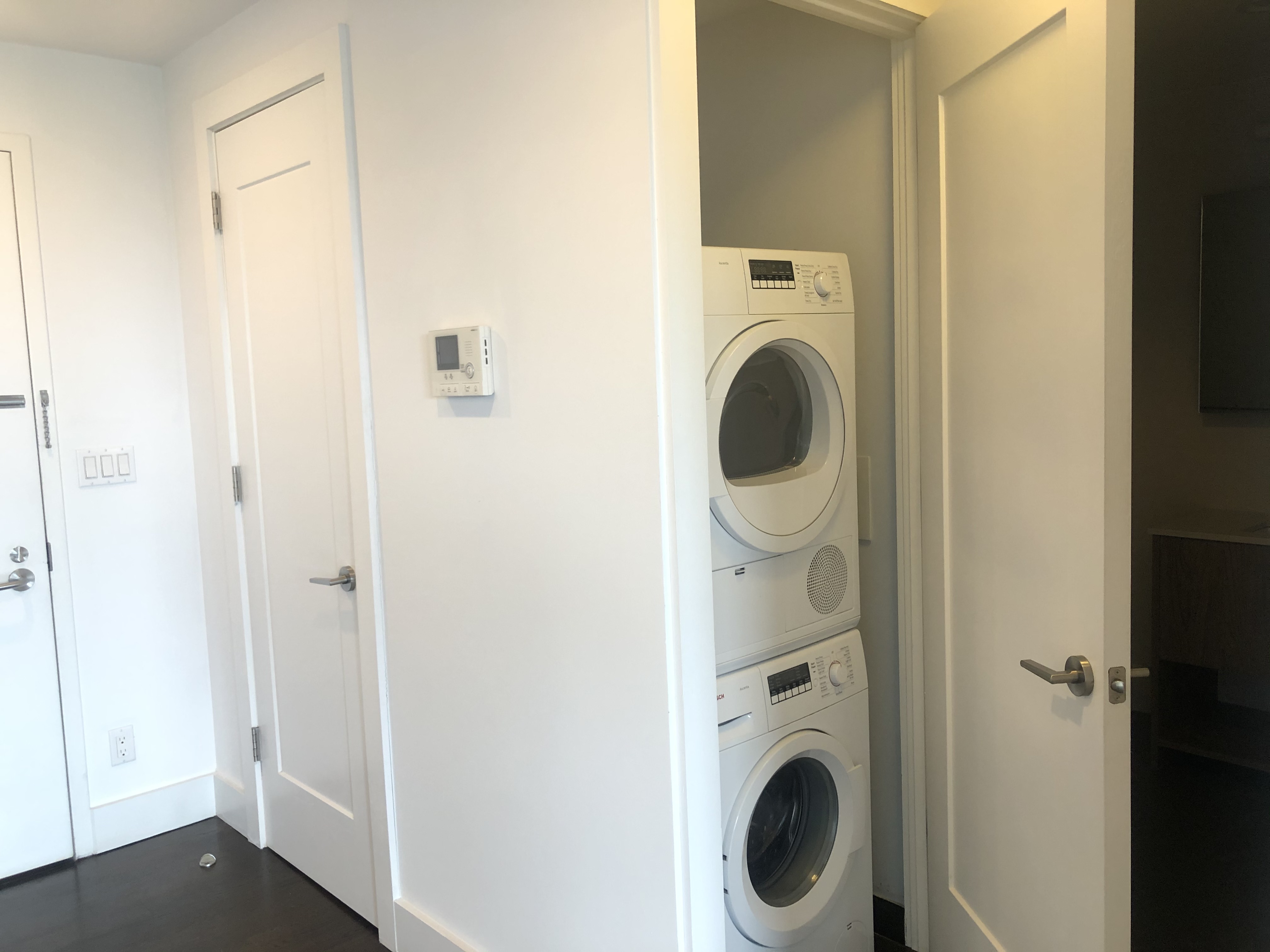 341 Eastern Parkway, Unit 5A Brooklyn, NY 11216 - Photo 5 of 10 a utility room with dryer and washer