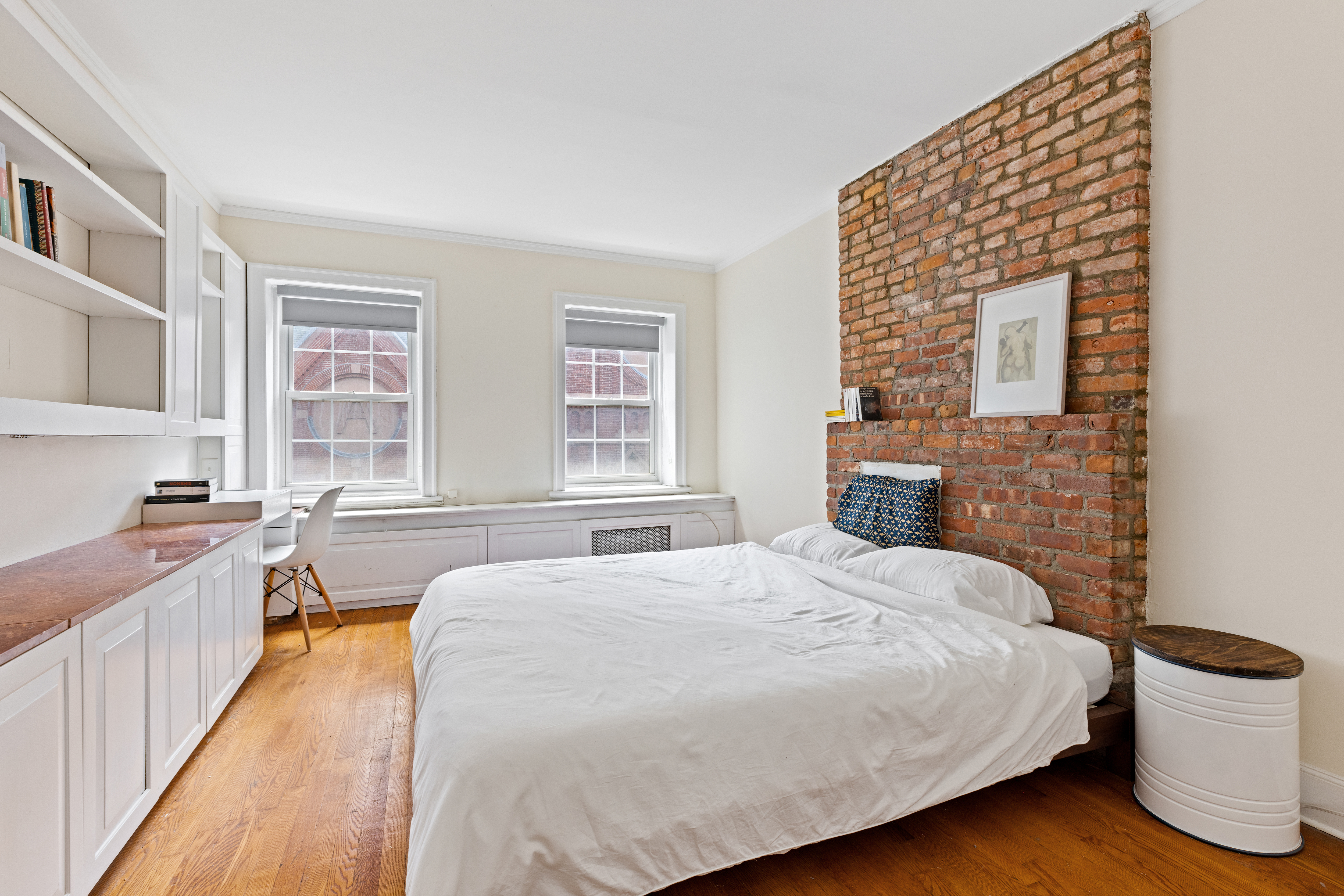 151 East 29th Street, Unit 2 Manhattan, NY 10016 - Photo 6 of 11 a spacious bedroom with a bed and wooden floor