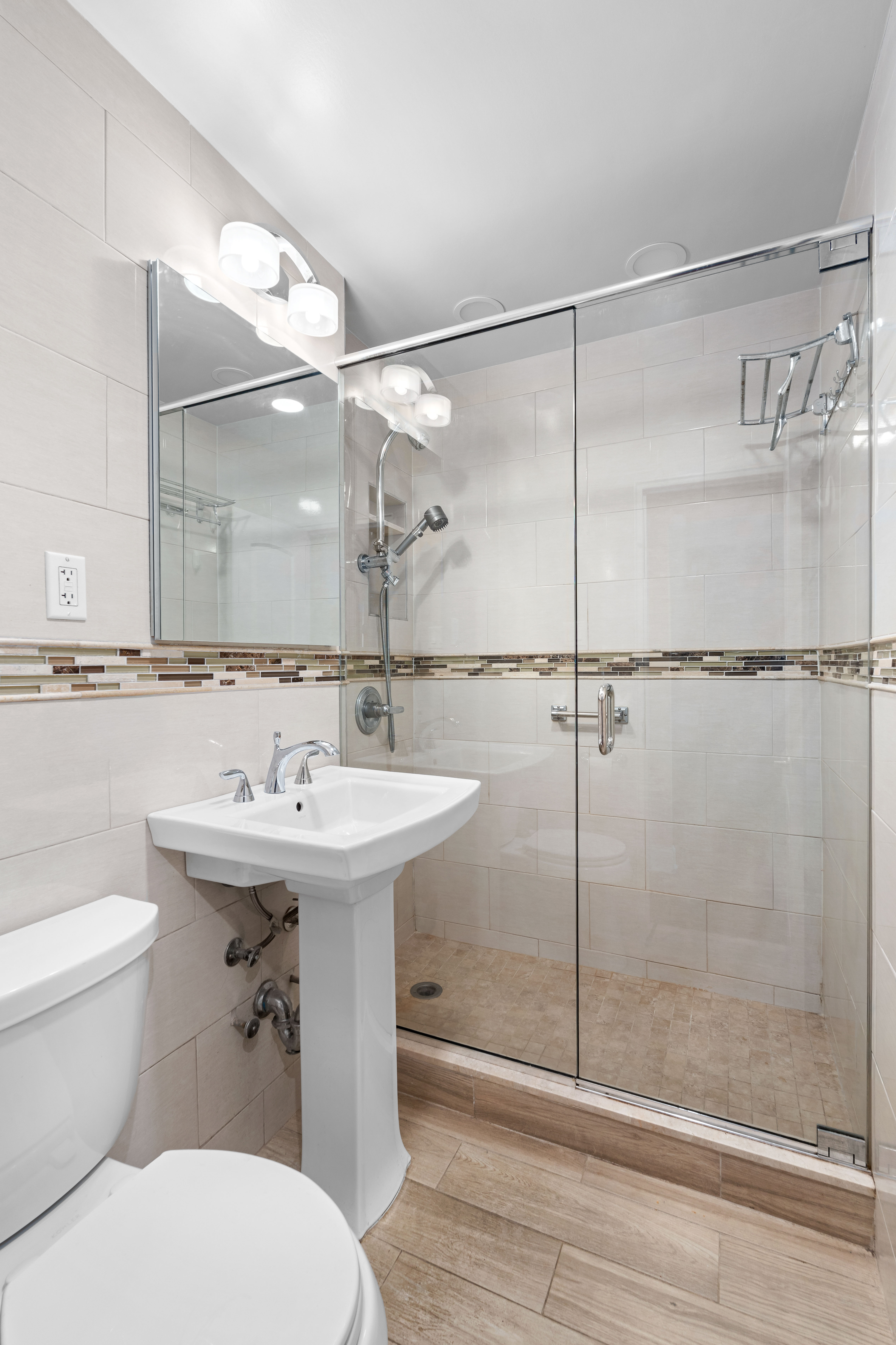 5800 Arlington Avenue, Unit 6L Bronx, NY 10471 - Photo 6 of 19 a bathroom with a sink toilet and shower