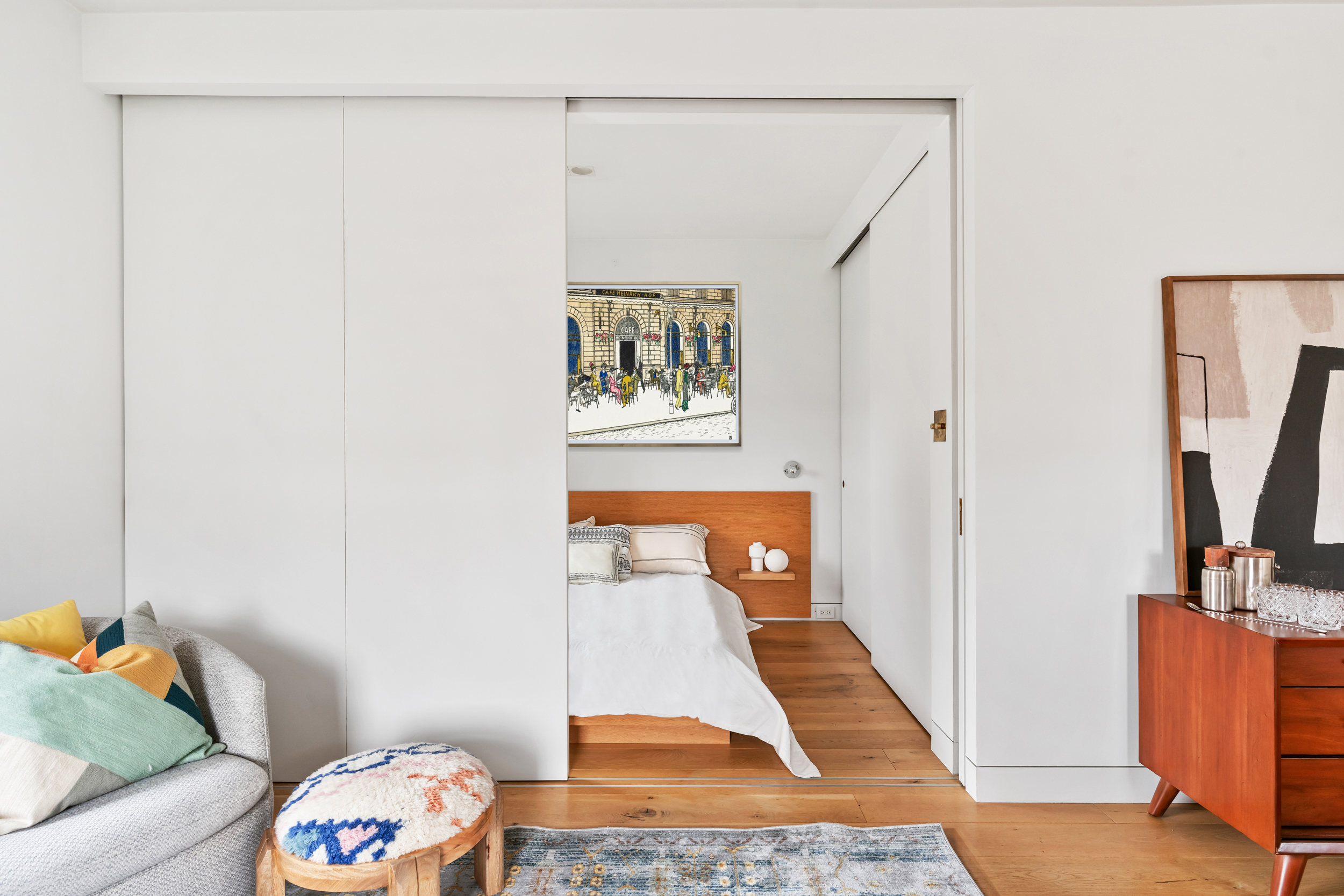 61 Horatio Street, Unit 5F Manhattan, NY 10014 - Photo 4 of 10 a room with wooden floor and a couch