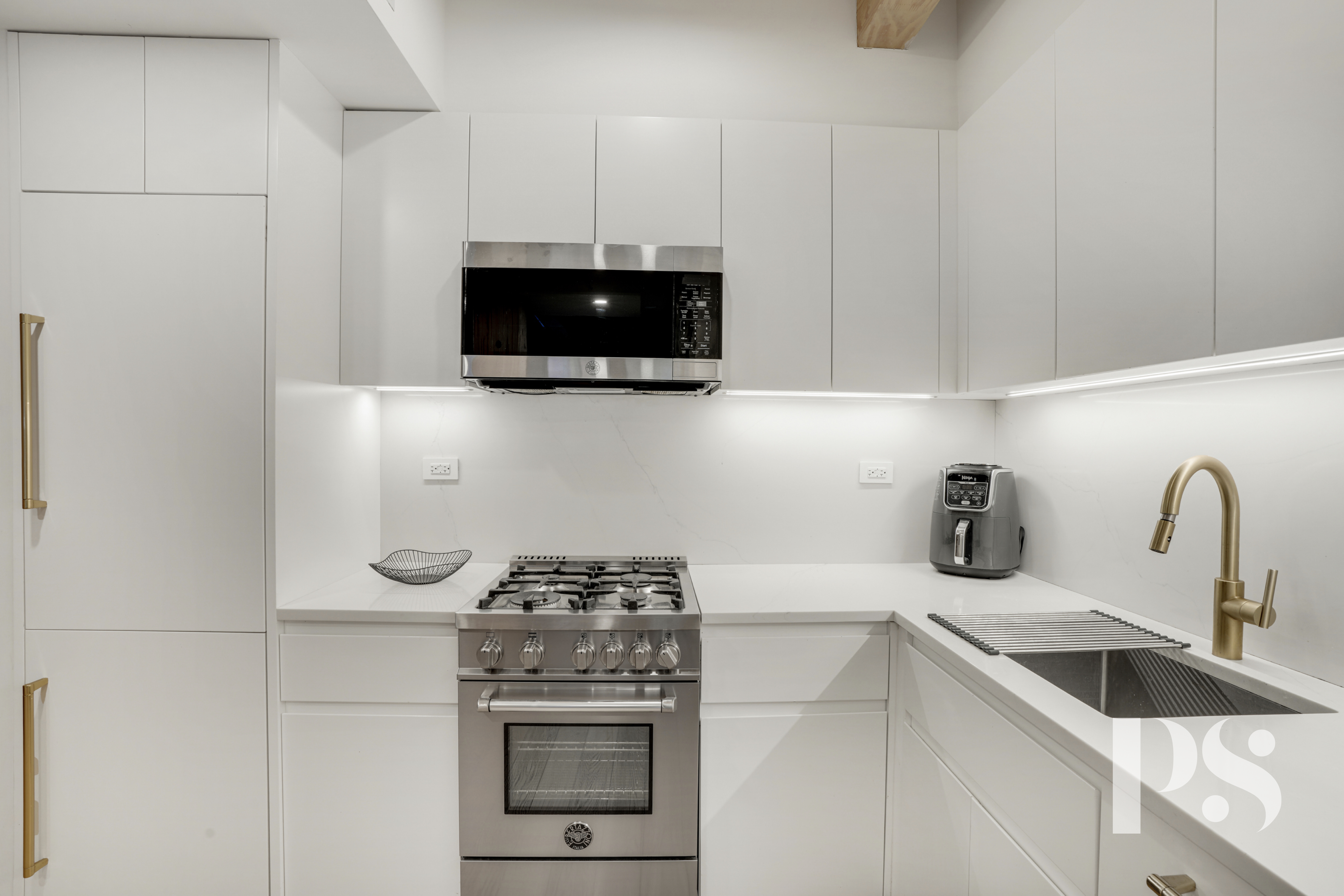 120 Java Street, Unit 1B Brooklyn, NY 11222 - Photo 2 of 12 a kitchen with a stove and a microwave