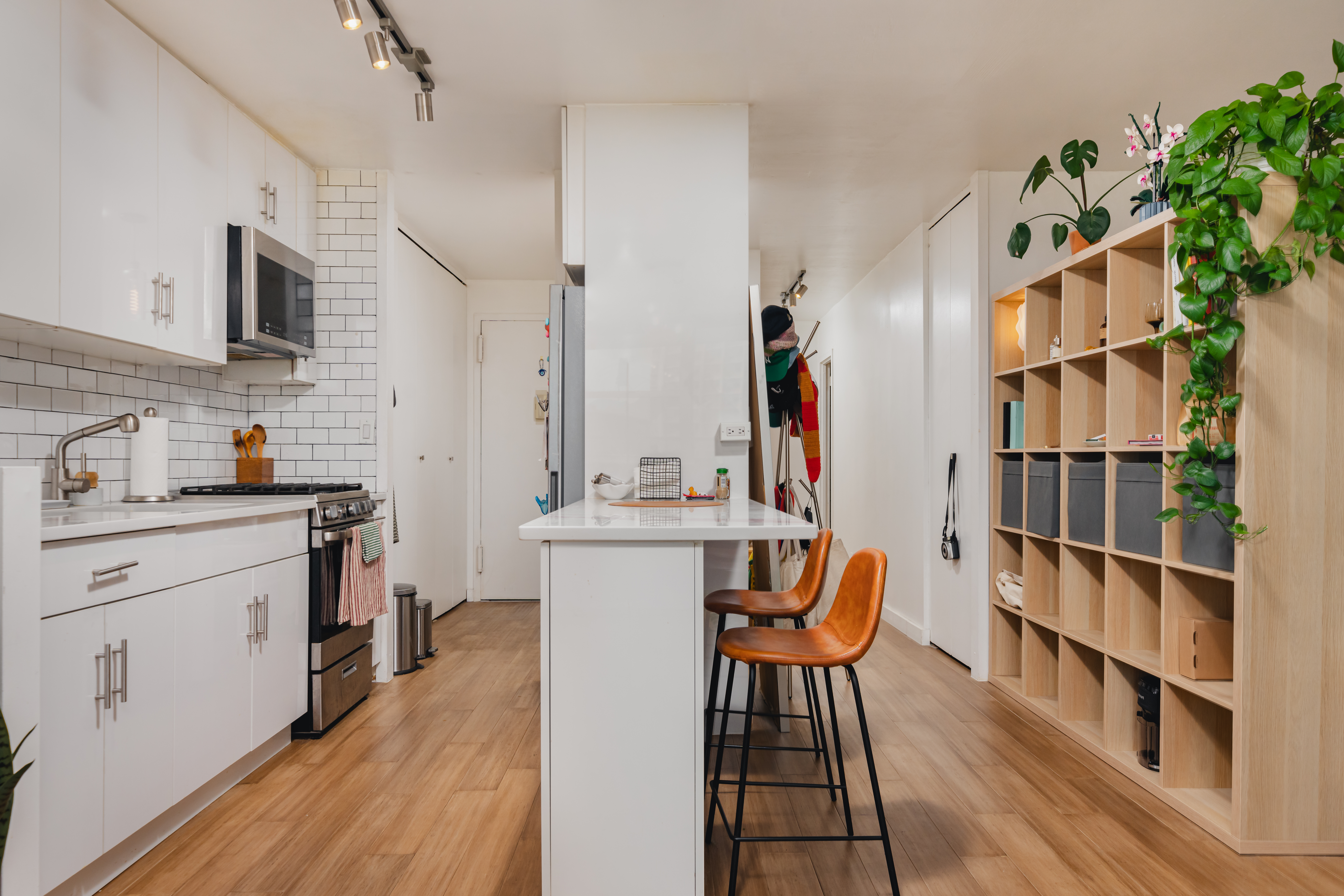 75 Henry Street, Unit 6D Brooklyn, NY 11201 - Photo 5 of 11 a kitchen with stainless steel appliances cabinets and a table