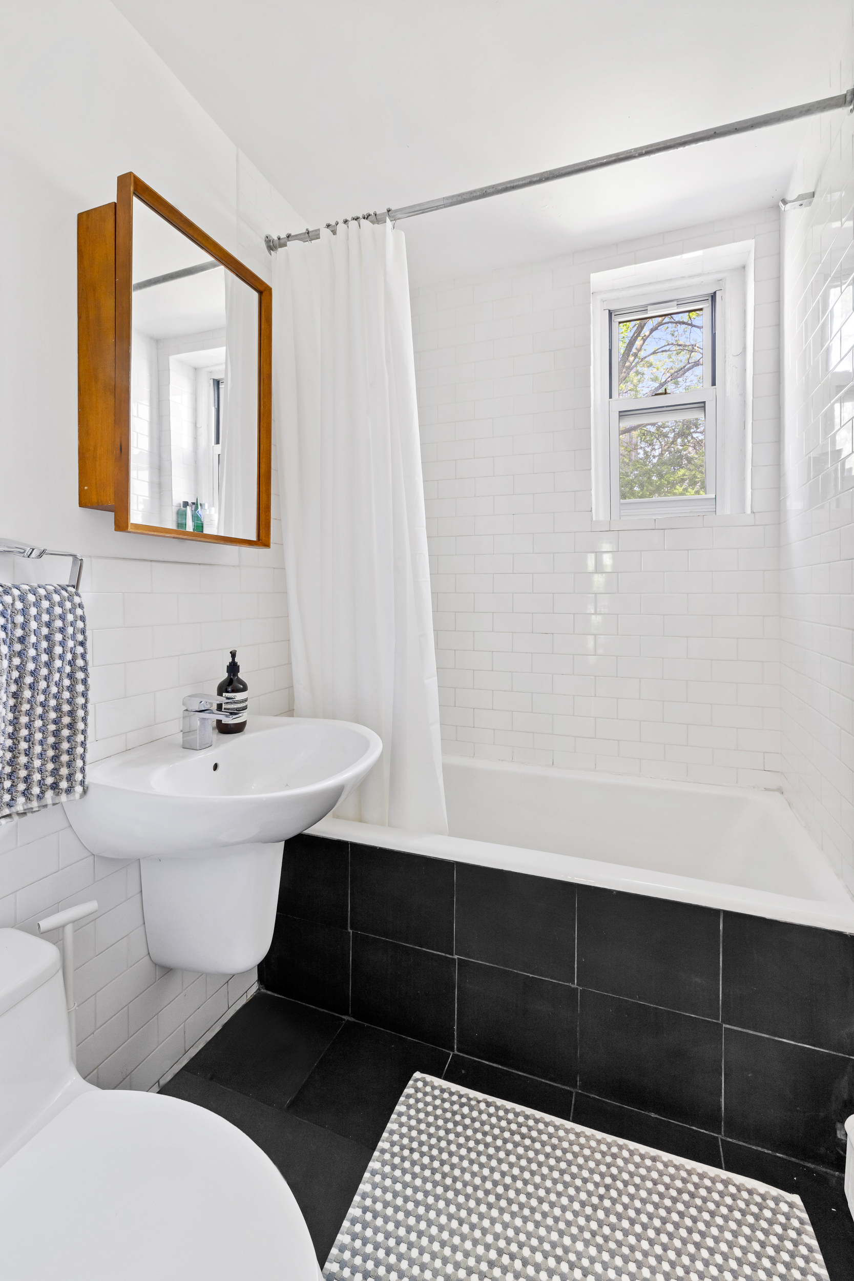 437 Warren Street Brooklyn, NY 11217 - Photo 11 of 17 a bathroom with a sink vanity mirror and toilet