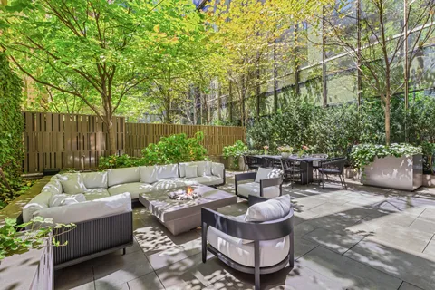 a patio with patio a couch and chairs