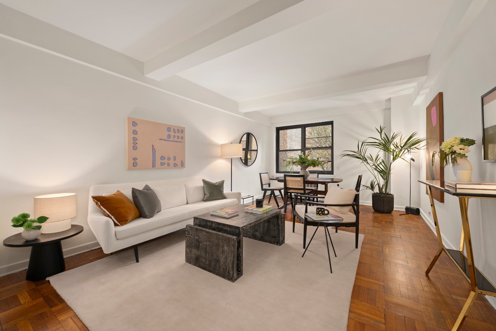 251 West 74th Street, Unit 3B Manhattan, NY 10023 - Photo 1 of 7 a living room with furniture and wooden floor