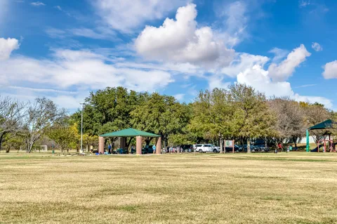 a view of a swimming pool with an outdoor space and seating area