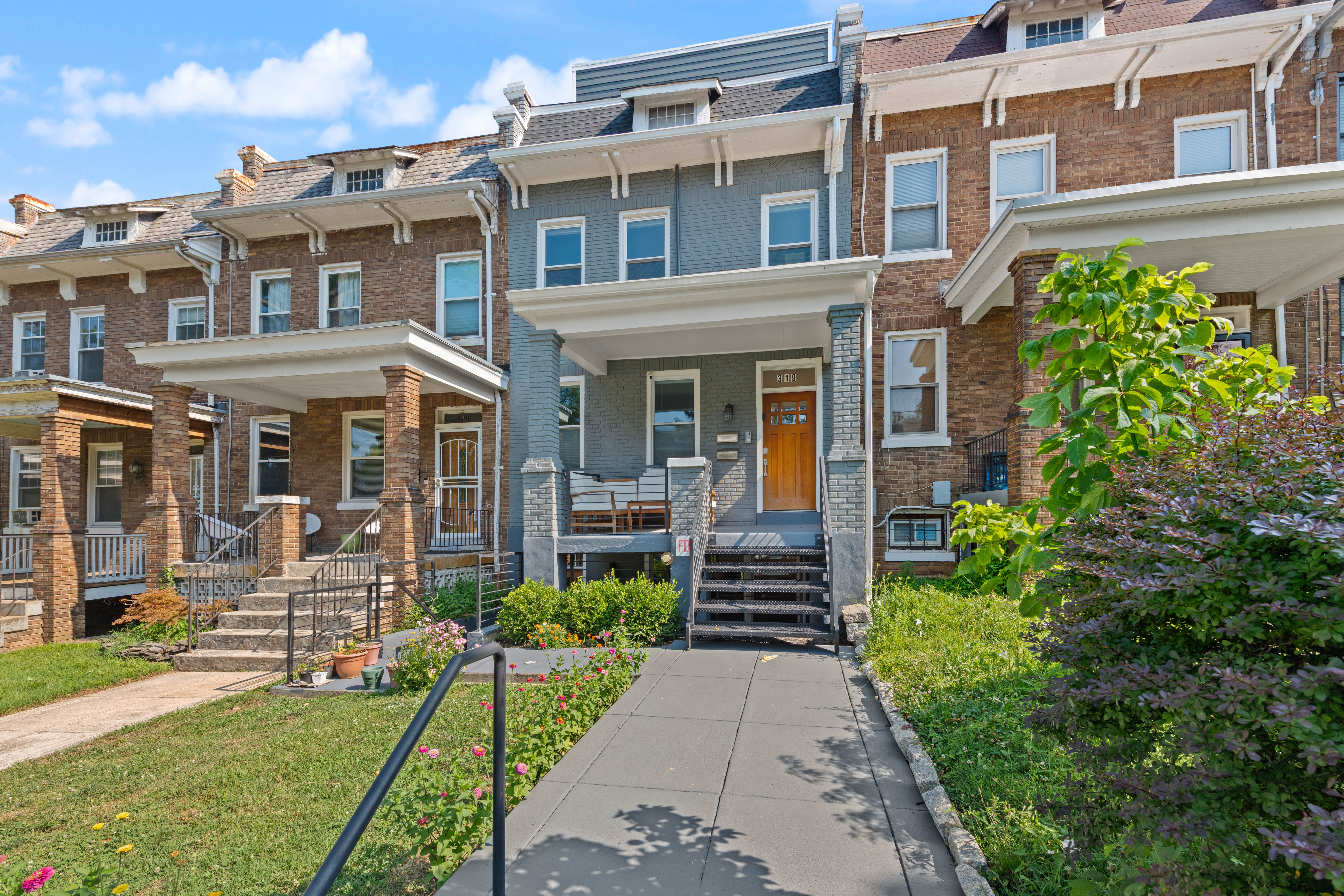 319 Varnum Street Northwest, Unit 3 Washington, DC 20011 - Photo 23 of 29 a front view of a house with a yard