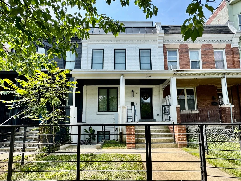 a view of a brick building with large windows
