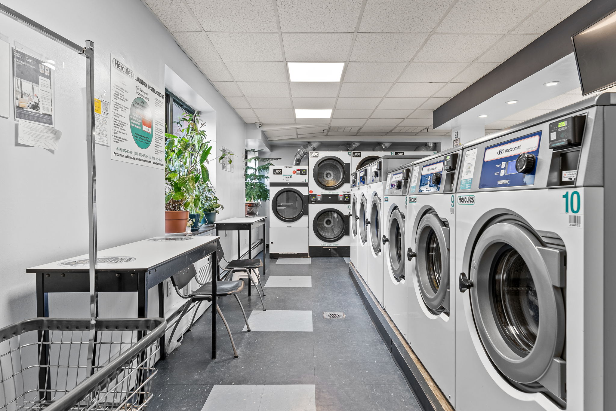 1919 Madison Avenue, Unit 214 Manhattan, NY 10035 - Photo 15 of 19 a view of a hallway with washer and dryer