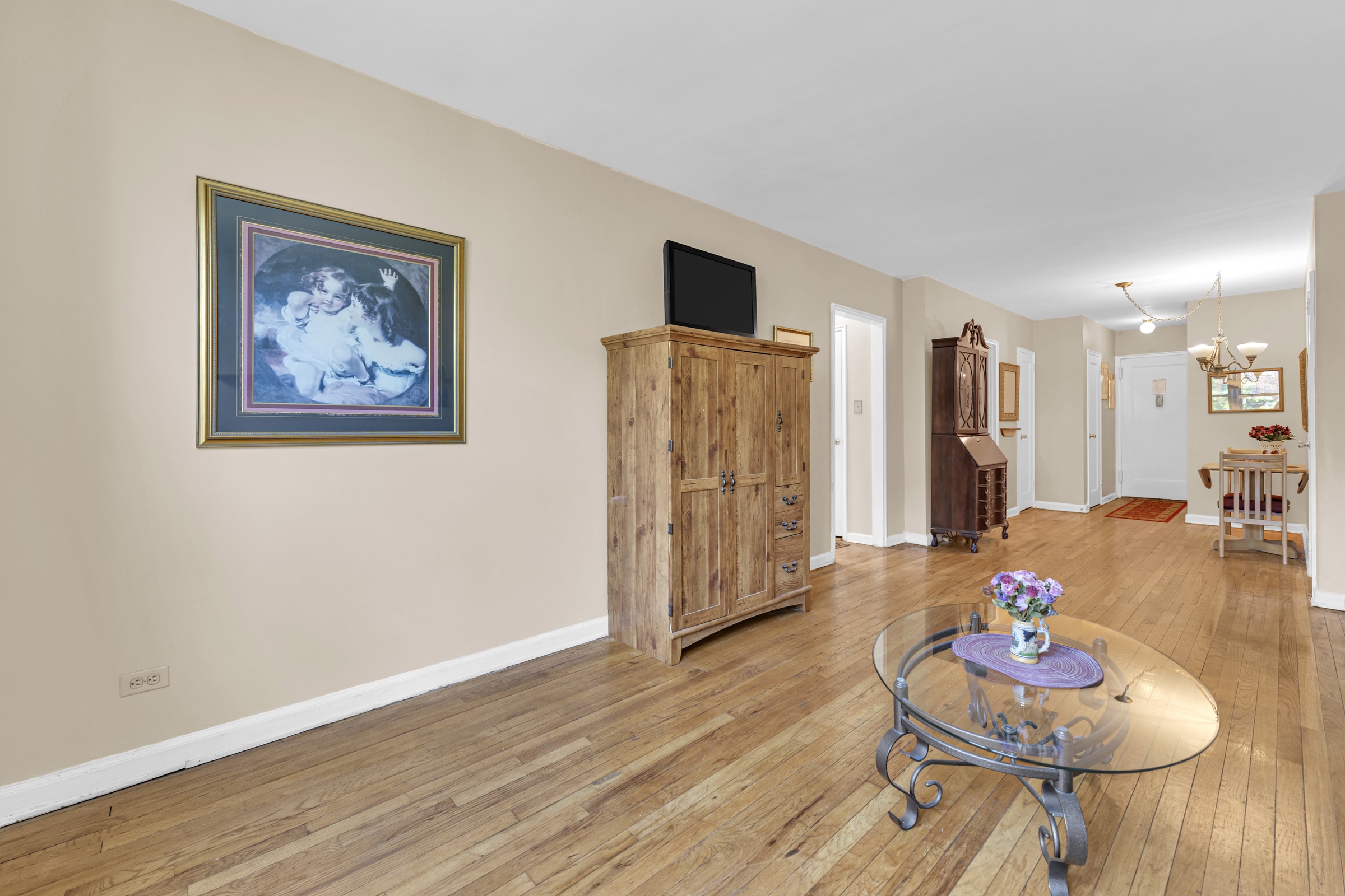 5614 Netherland Avenue, Unit 3E Bronx, NY 10471 - Photo 7 of 13 a living room with furniture and wooden floor