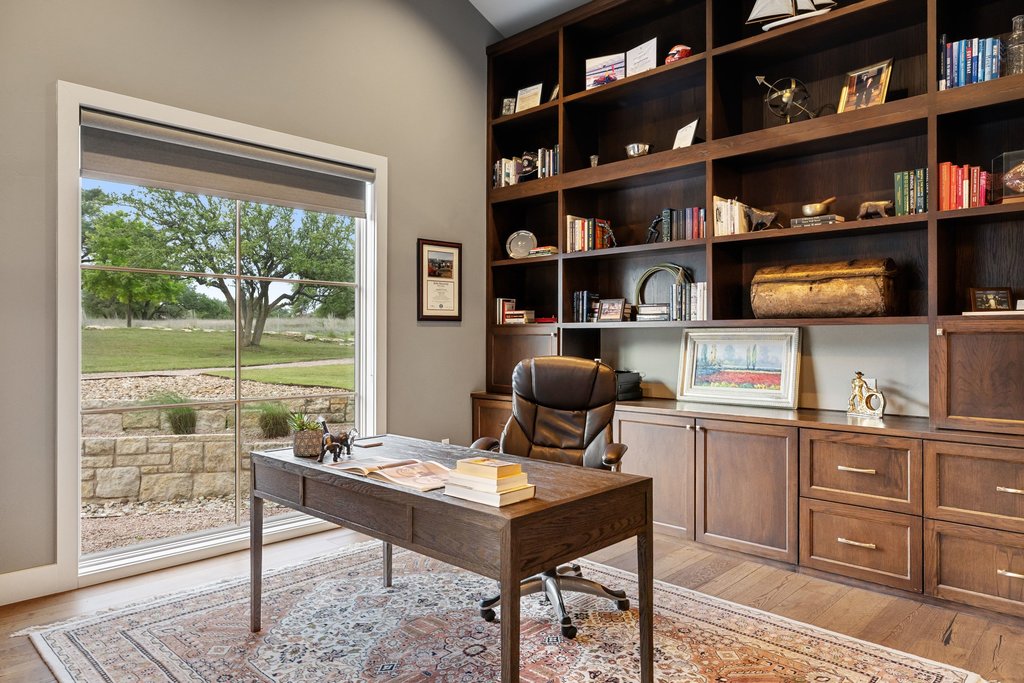 2560 Bell Springs Road Dripping Springs, TX 78620 - Photo 41 of 42 a work room with furniture and a bookshelf