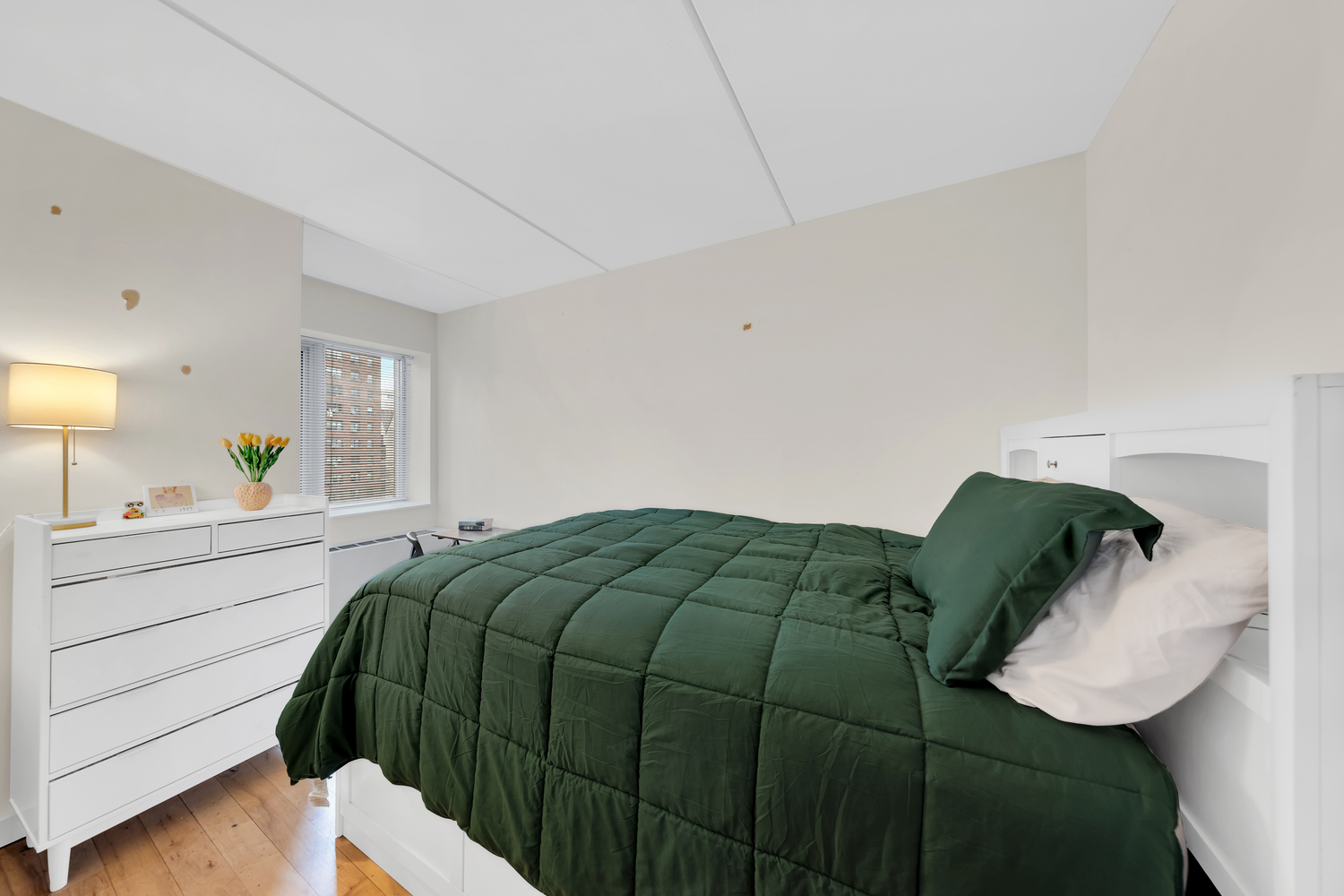 1810 3rd Avenue, Unit A7C Manhattan, NY 10029 - Photo 4 of 12 a bedroom with a bed and window