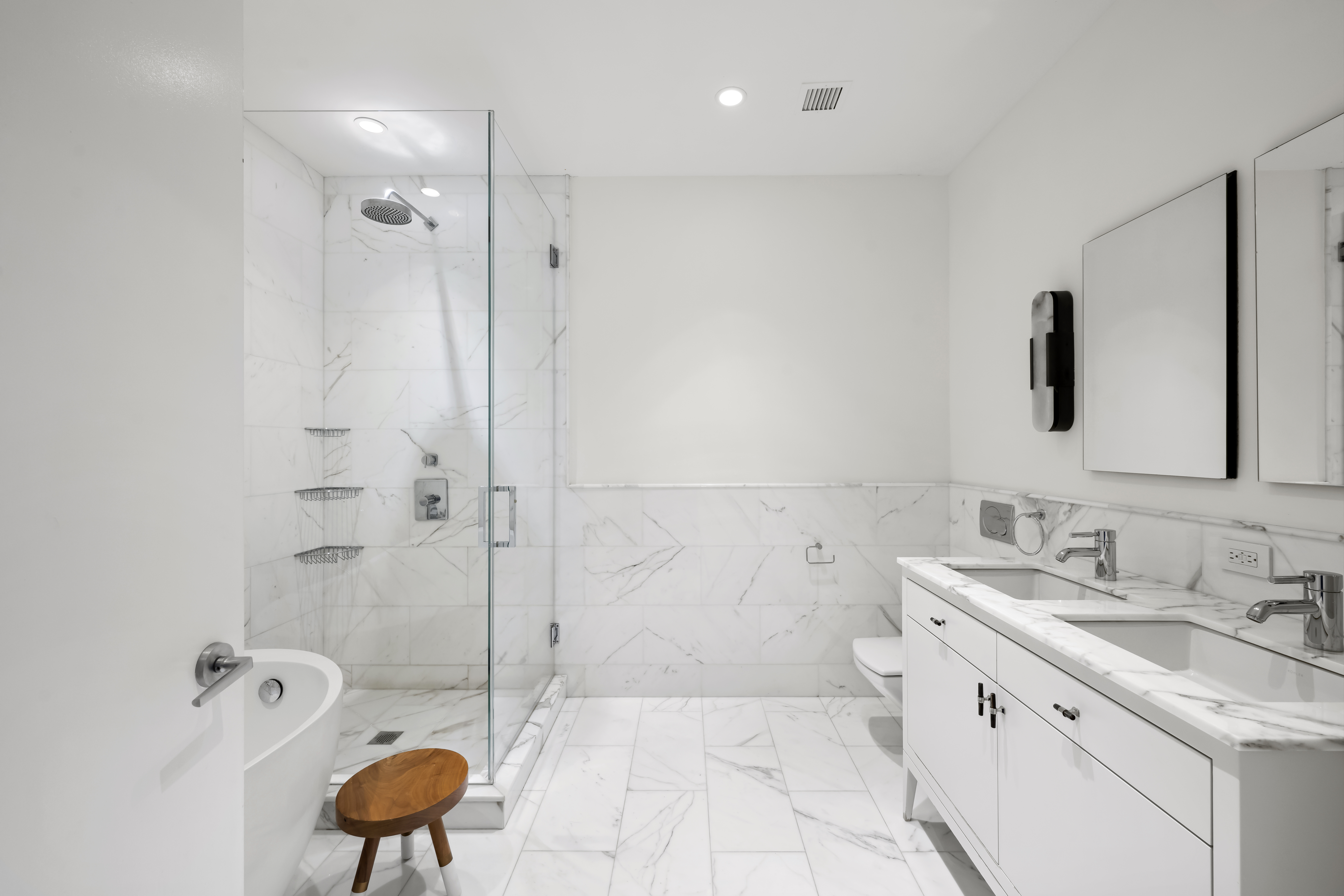 60 West 20th Street, Unit 2F Manhattan, NY 10011 - Photo 10 of 21 a bathroom with a sink a toilet a mirror and shower