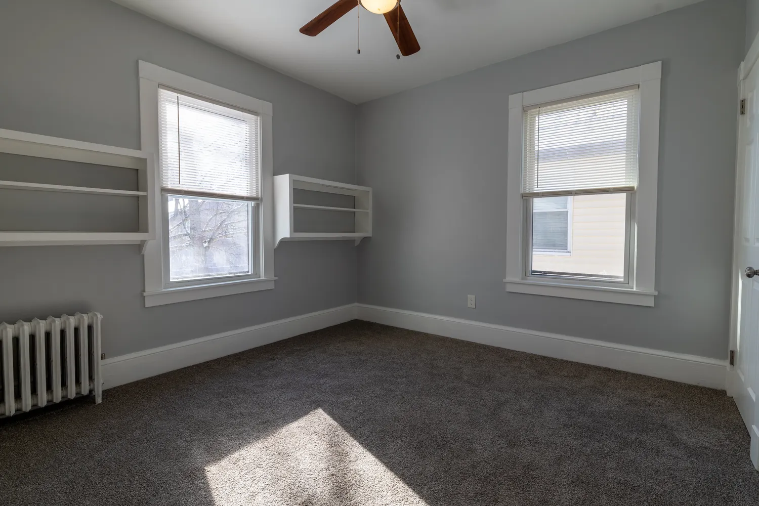 an empty room with windows