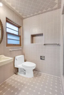 a bathroom with a toilet a sink and a bathtub