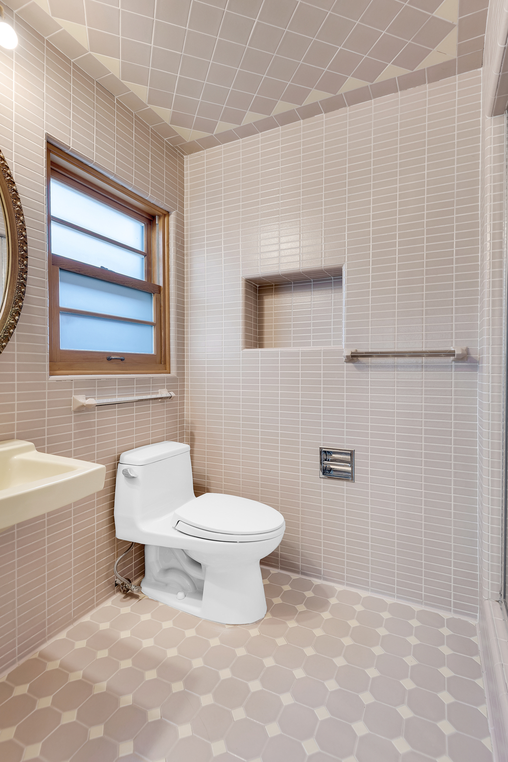 95 83rd Street Brooklyn, NY 11209 - Photo 16 of 18 a bathroom with a toilet a sink and a bathtub