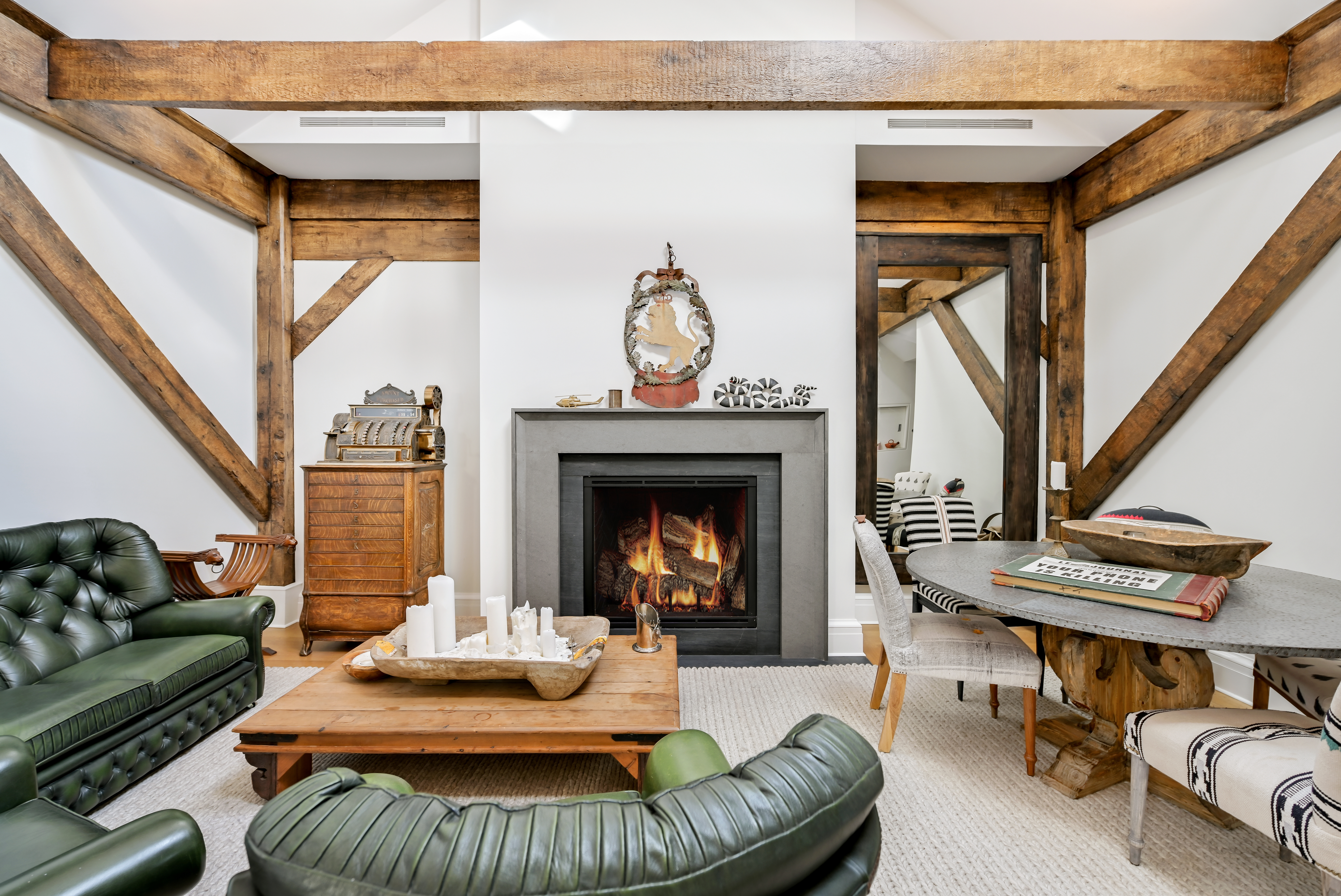 38 Prince Street Manhattan, NY 10012 - Photo 15 of 17 a living room with furniture and a fireplace
