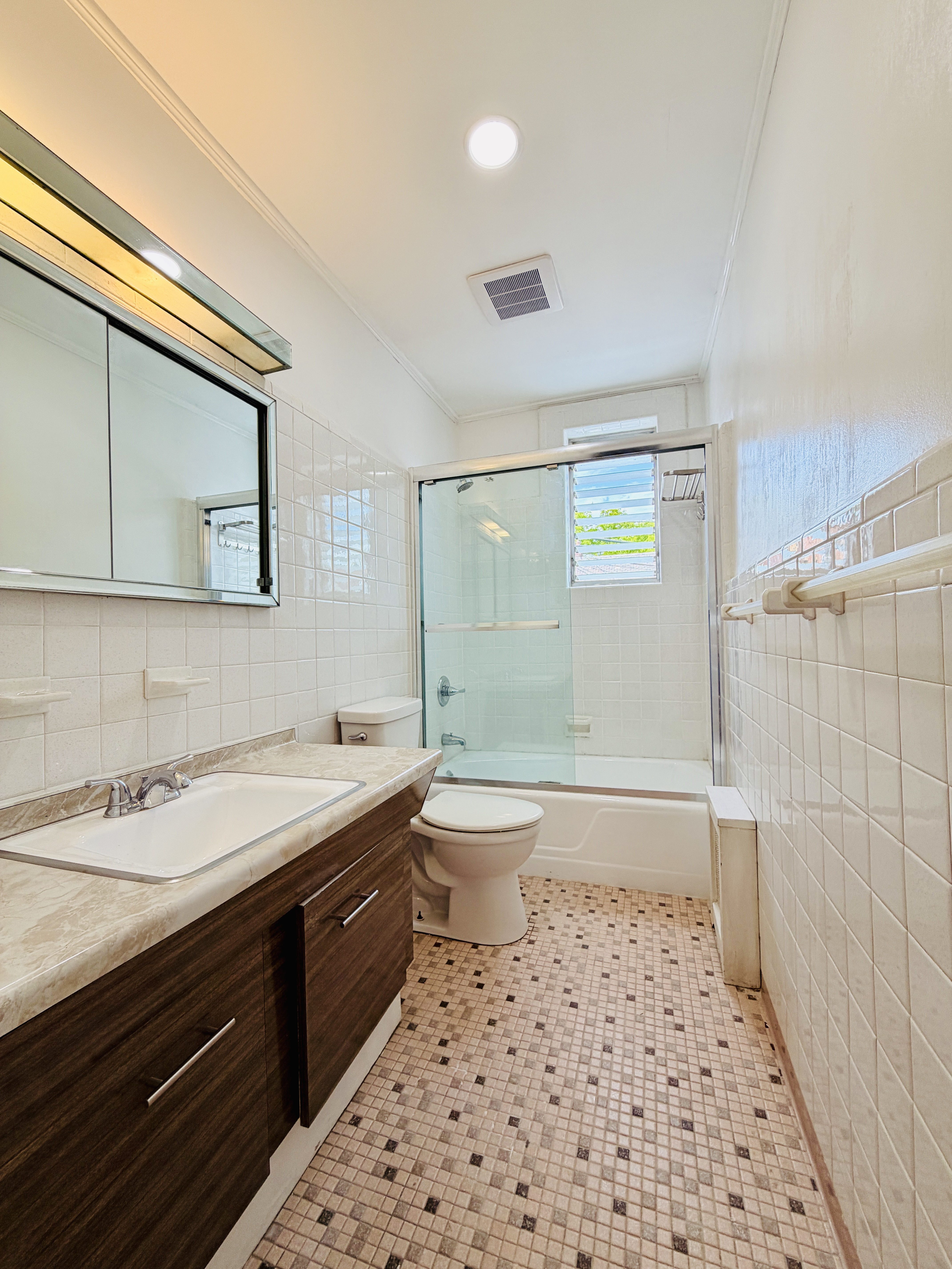 63-33 Haring Street, Unit 1F Queens, NY 11374 - Photo 13 of 13 a bathroom with a sink a toilet and shower