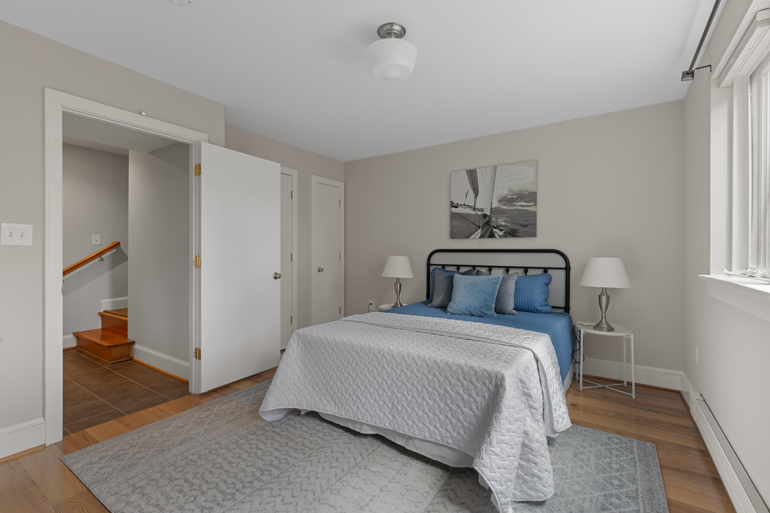 1908 Glen Ross Road Silver Spring, MD 20910 - Photo 42 of 63 a bedroom with a bed and a mirror