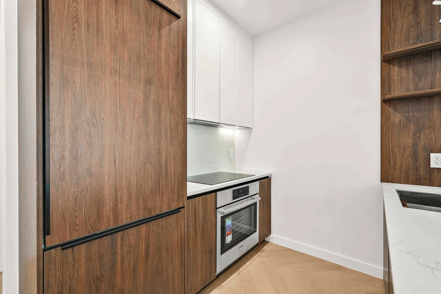 a kitchen with stainless steel appliances granite countertop a refrigerator and a stove