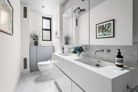 a bathroom with a sink toilet and a bathtub