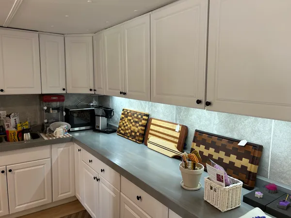 a kitchen with a sink and cabinets