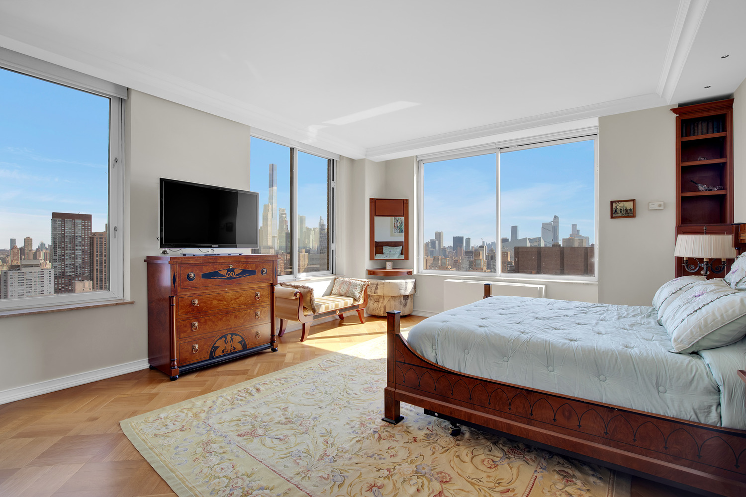 200 Riverside Boulevard, Unit 44A Manhattan, NY 10069 - Photo 9 of 22 a bedroom with a bed and a television