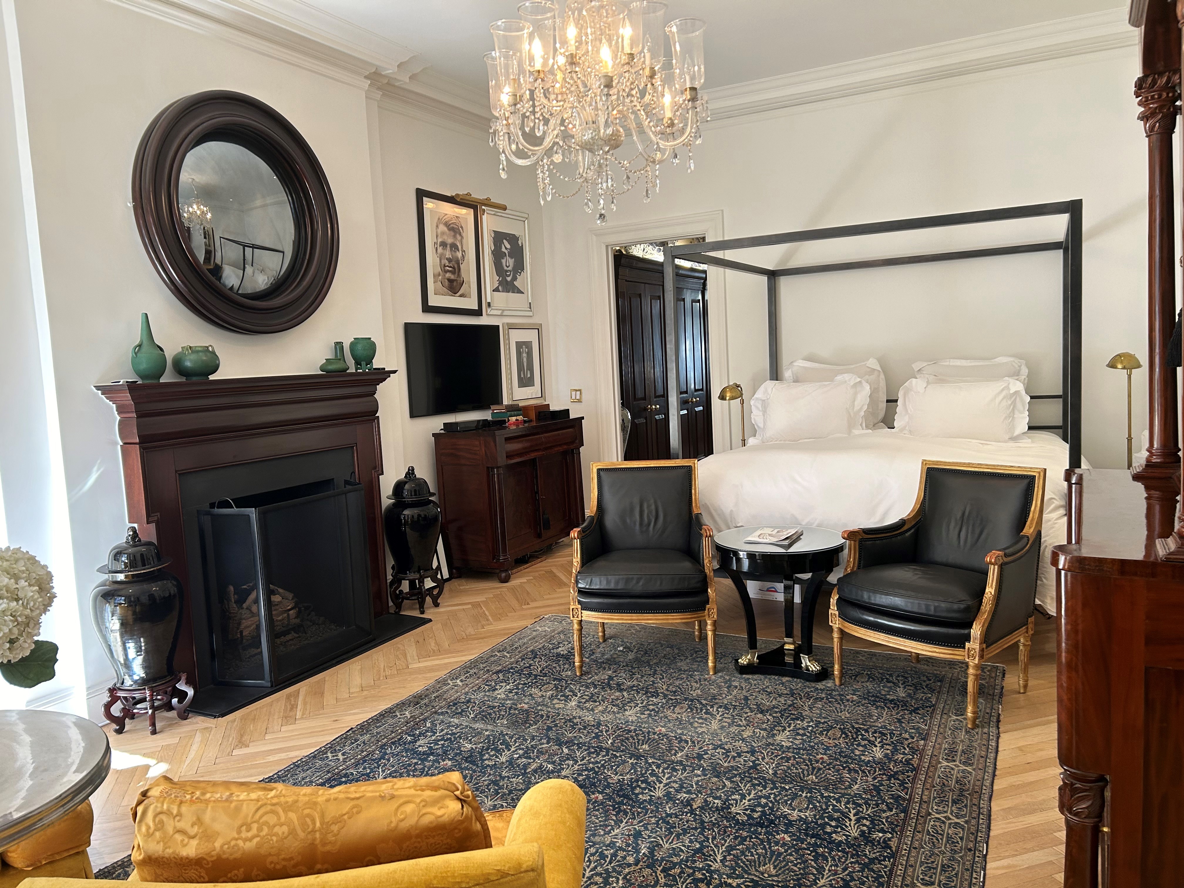 36 East 69th Street, Unit 2AB Manhattan, NY 10021 - Photo 24 of 26 a living room with furniture a chandelier and a fireplace